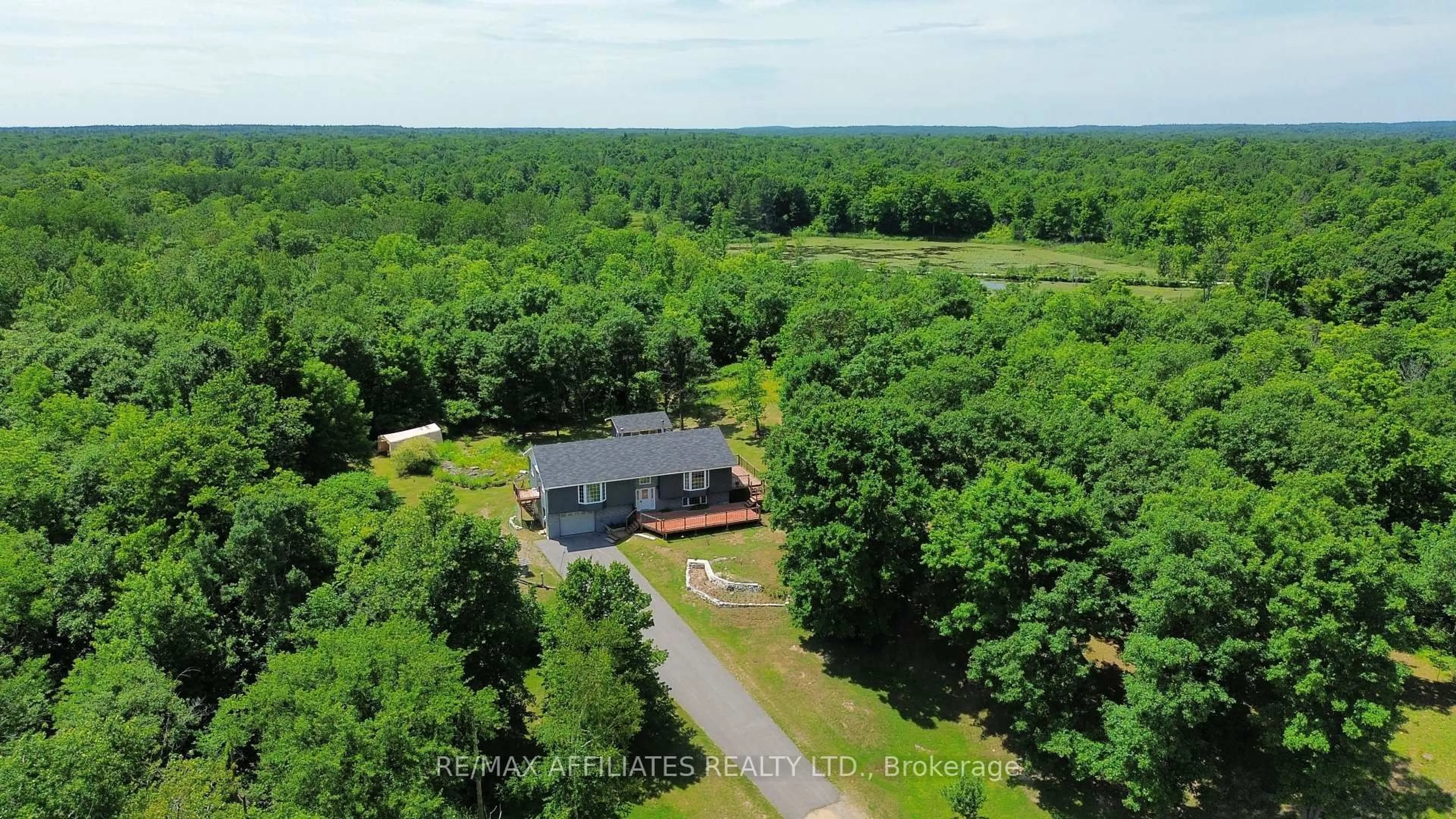 A pic from outside/outdoor area/front of a property/back of a property/a pic from drone, water/lake/river/ocean view for 13481 38 Highway, Sharbot Lake Ontario K0H 2P0