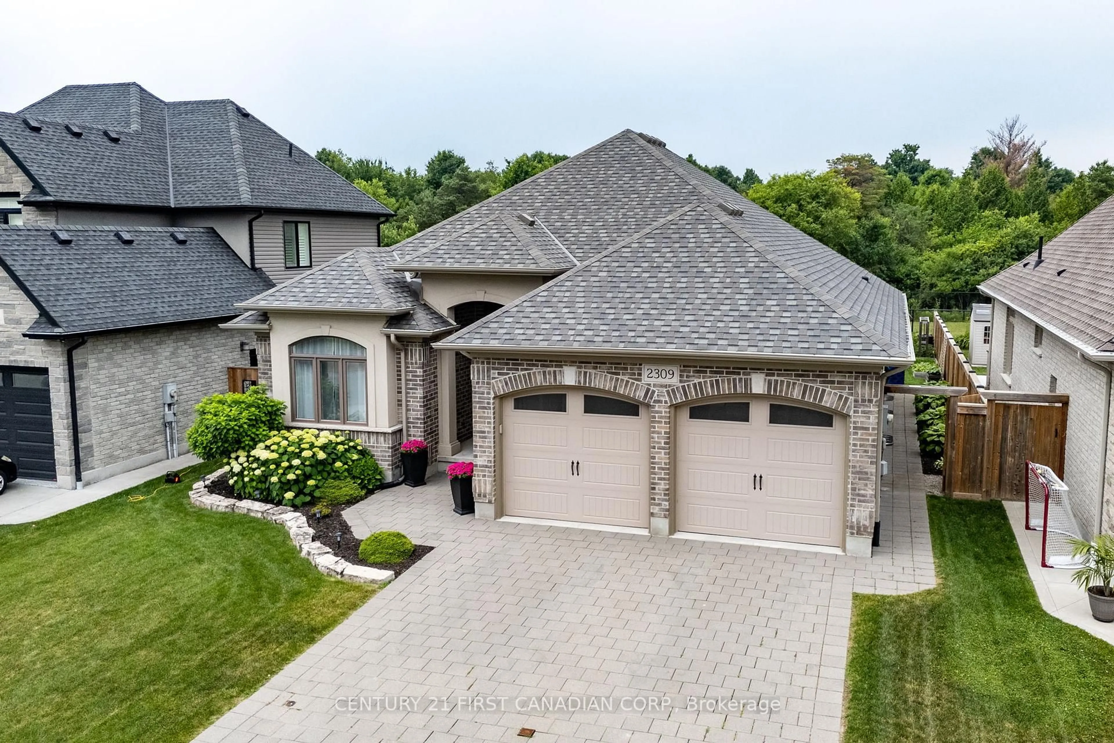 A pic from outside/outdoor area/front of a property/back of a property/a pic from drone, street for 2309 Springridge Dr, London North Ontario N5X 0J7