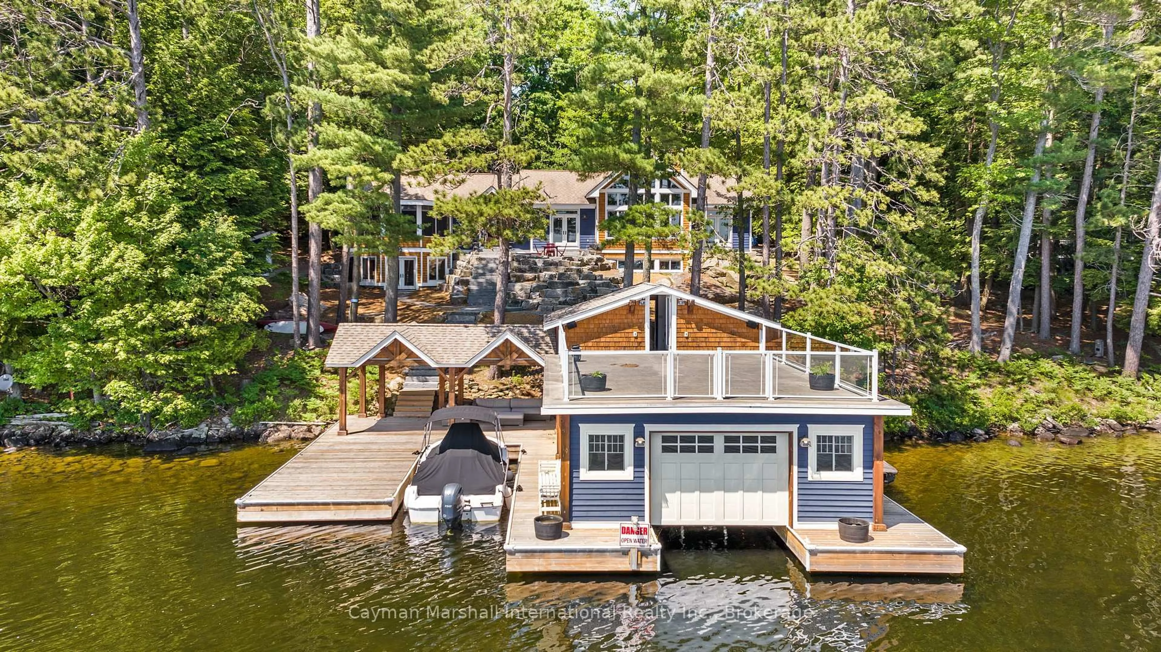 A pic from outside/outdoor area/front of a property/back of a property/a pic from drone, water/lake/river/ocean view for 50 BIGWIN Island, Lake of Bays Ontario P0B 1A0
