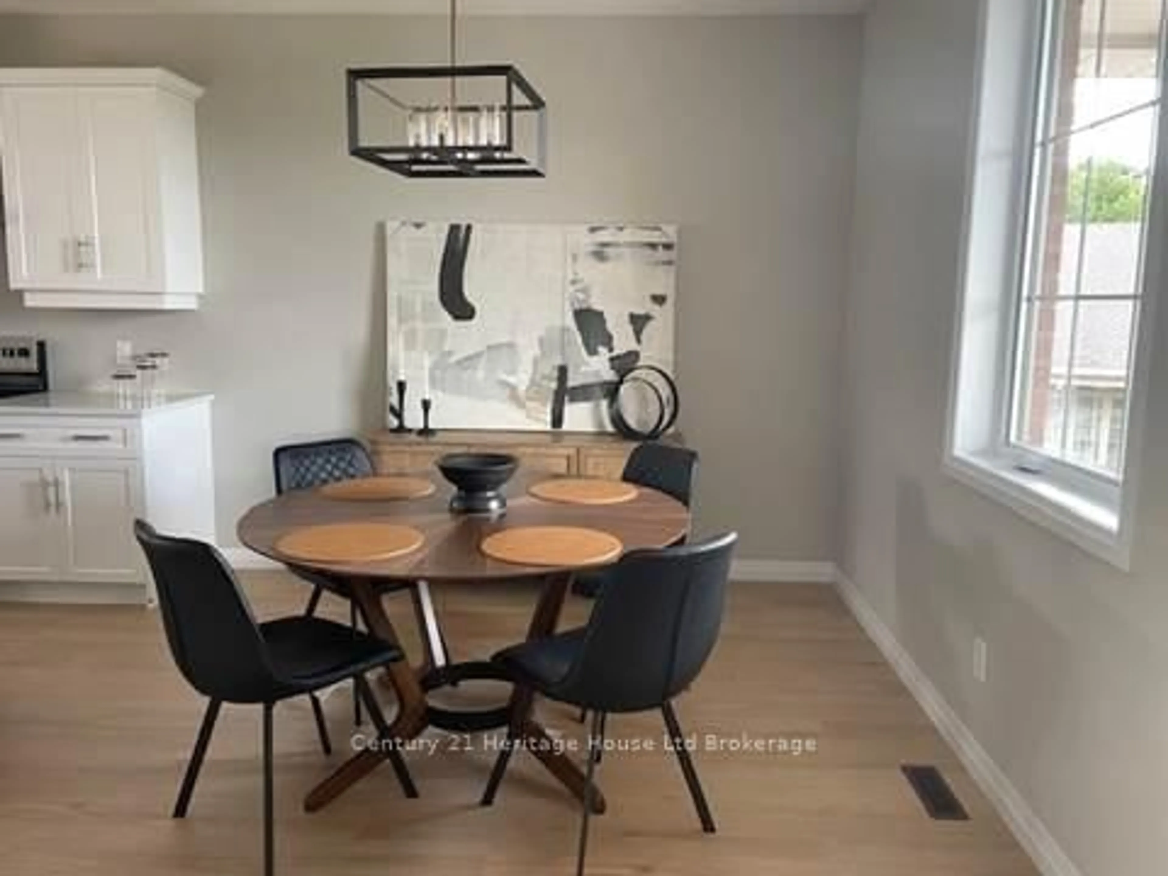 Dining room, wood/laminate floor for 19 Anderson St #14, Woodstock Ontario N4S 9A3