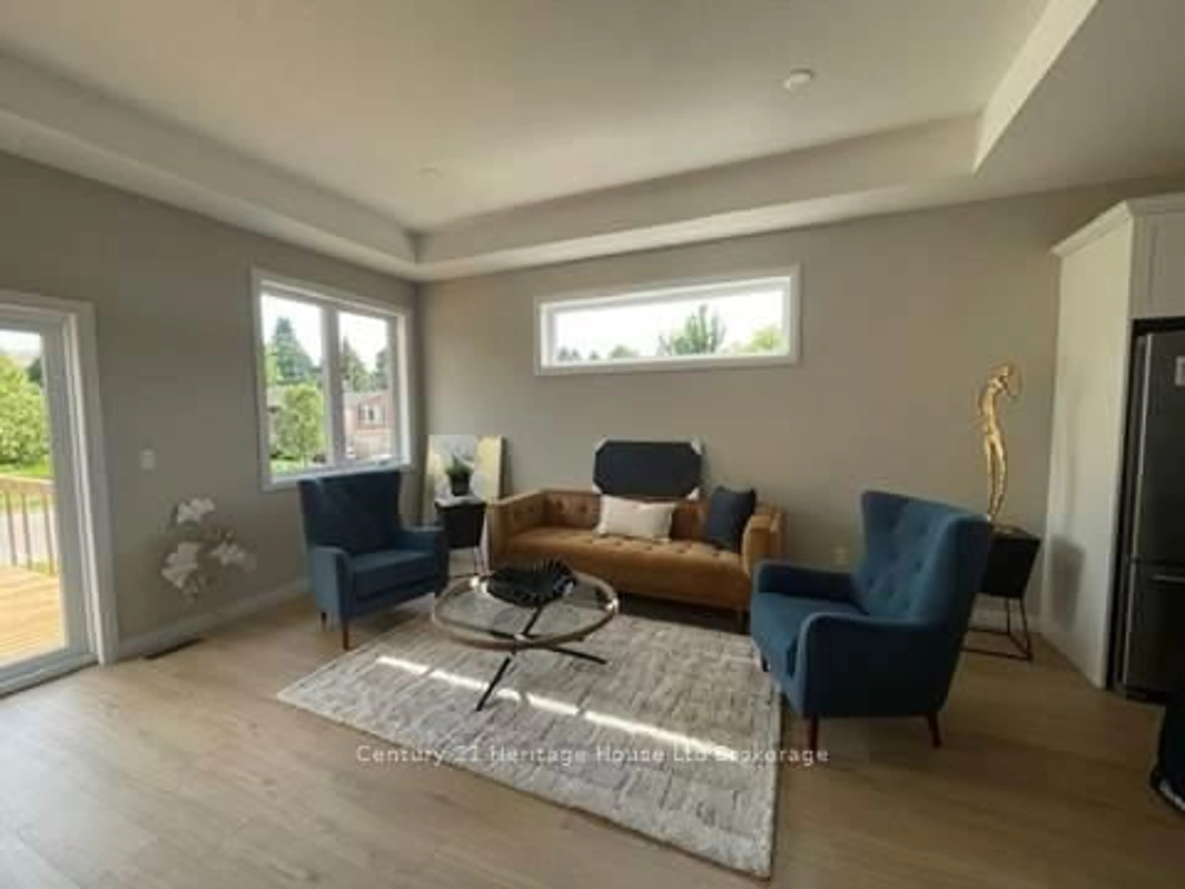 Living room with furniture, wood/laminate floor for 19 Anderson St #14, Woodstock Ontario N4S 9A3