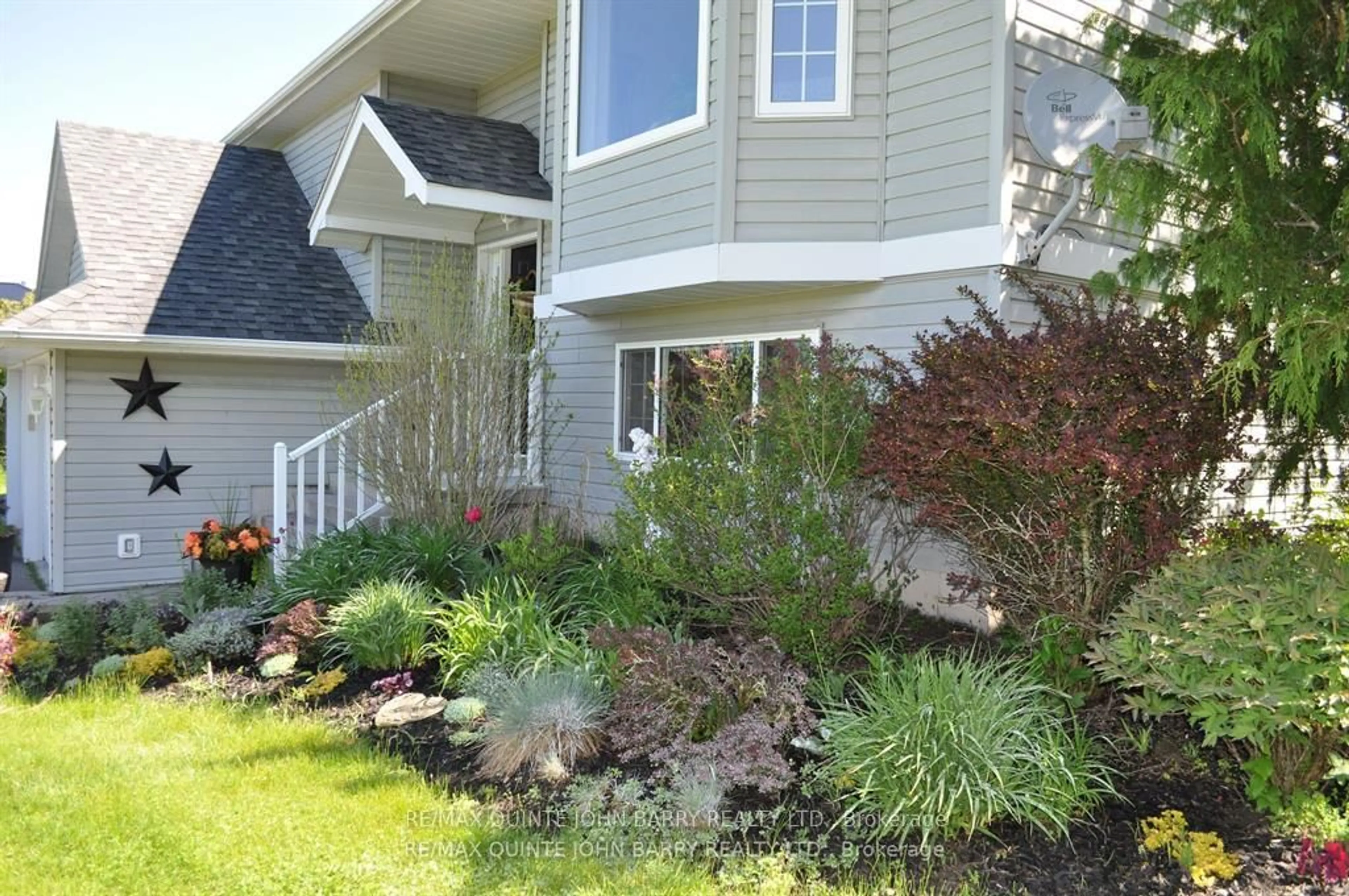 Home with vinyl exterior material, street for 77 Fitzgerald Rd, Quinte West Ontario K8V 0B1