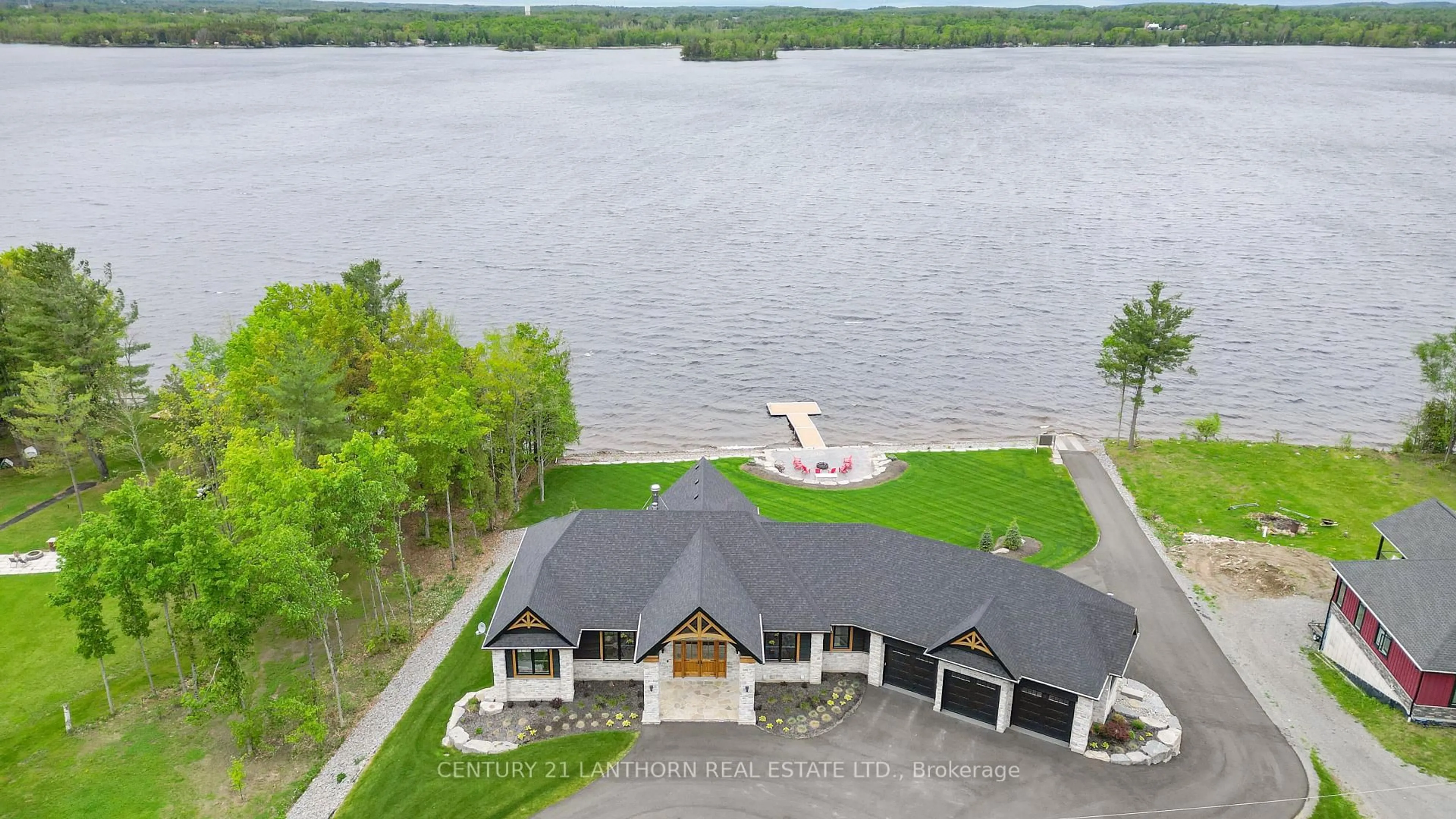 A pic from outside/outdoor area/front of a property/back of a property/a pic from drone, water/lake/river/ocean view for 555 Mile Point Lane, Madoc Ontario K0K 2K0