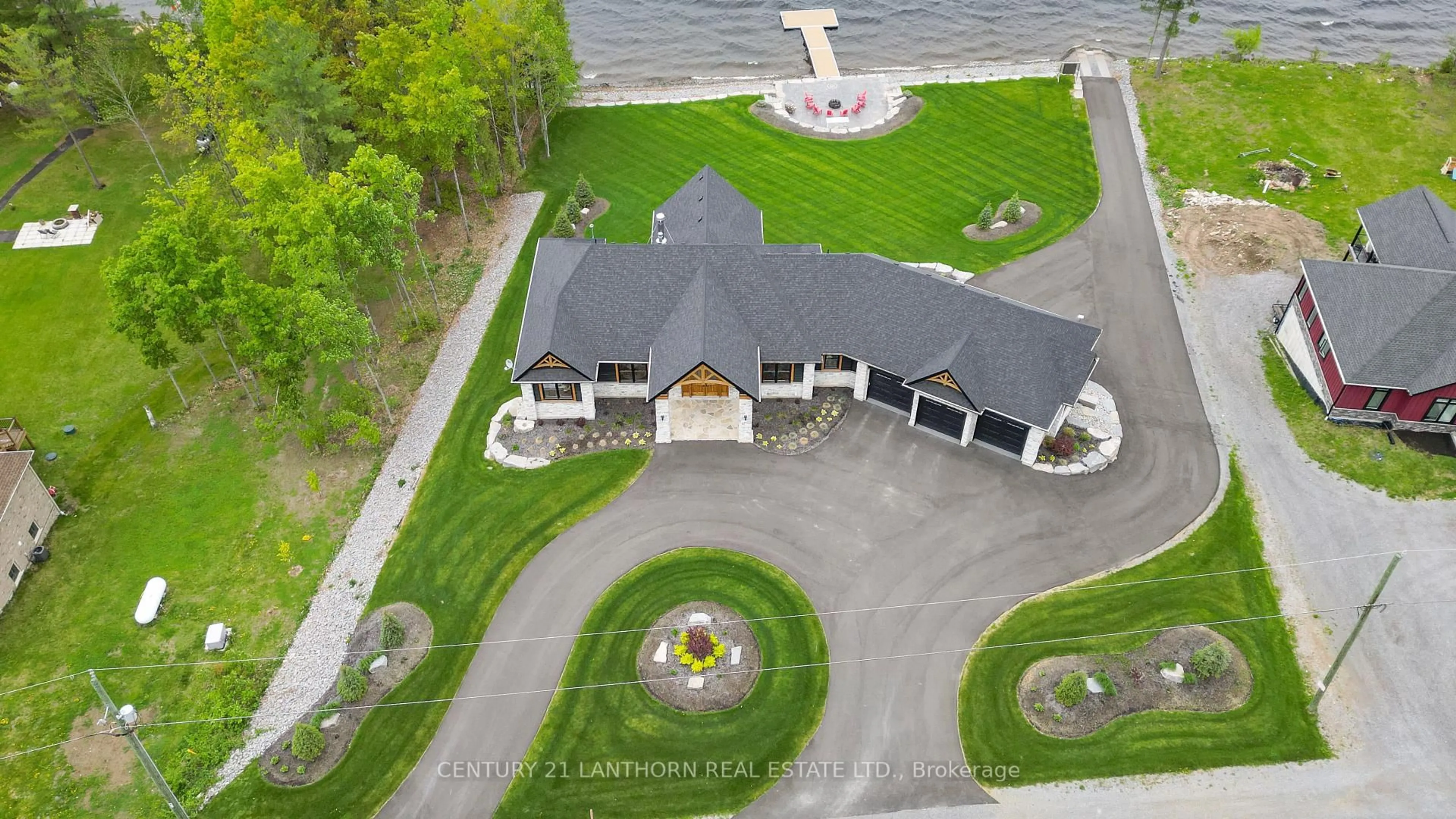 A pic from outside/outdoor area/front of a property/back of a property/a pic from drone, water/lake/river/ocean view for 555 Mile Point Lane, Madoc Ontario K0K 2K0
