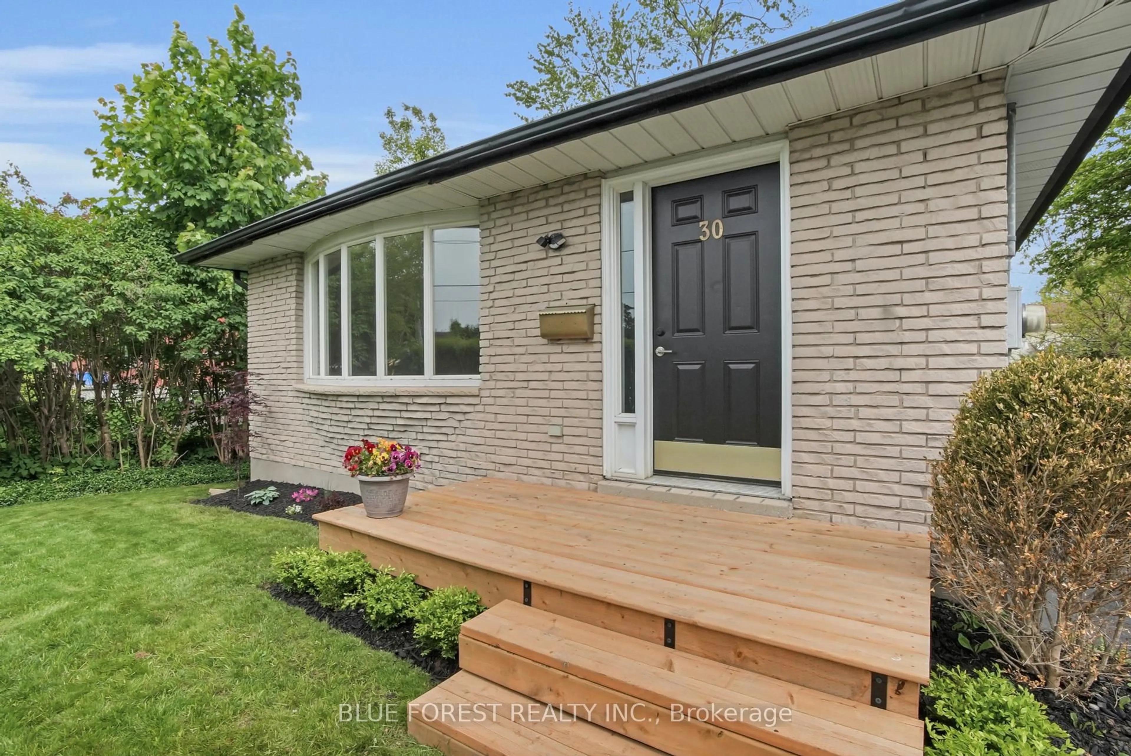 Home with brick exterior material, street for 30 Baseline Rd, London South Ontario N6C 2N5
