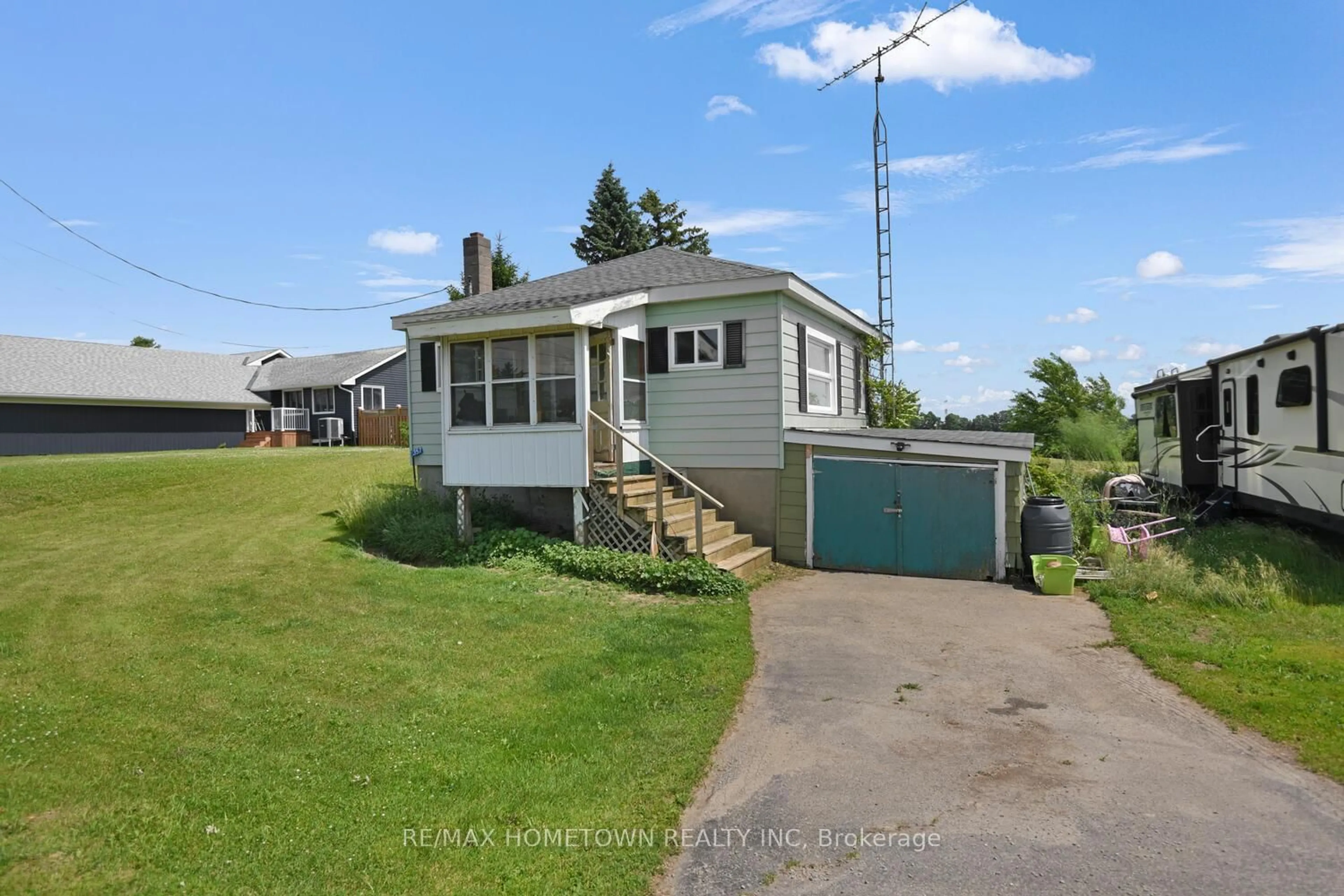 A pic from outside/outdoor area/front of a property/back of a property/a pic from drone, street for 357 County Road 8 Rd, Rideau Lakes Ontario K0G 1E0