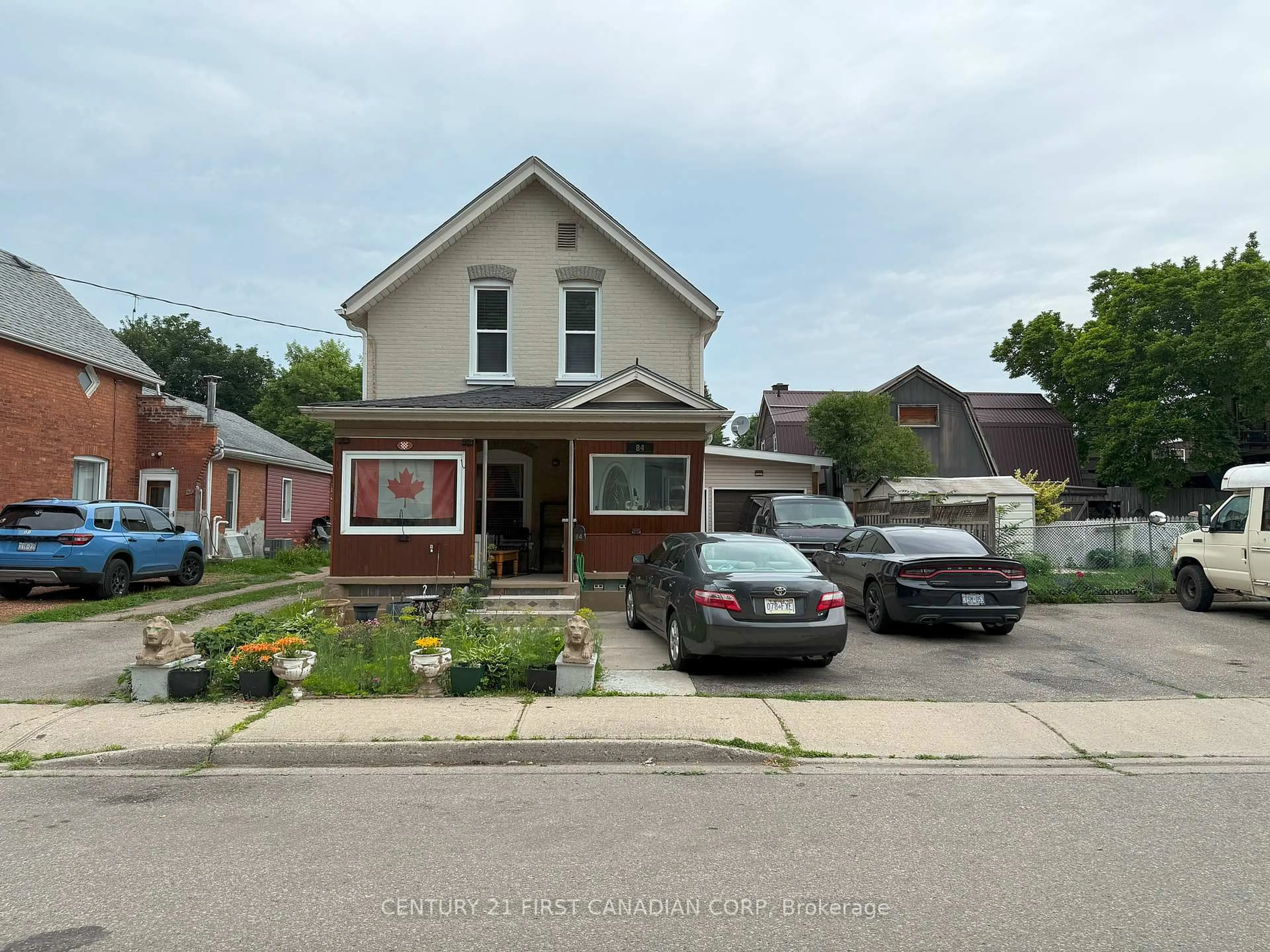 Home with brick exterior material, street for 84 Port St, Brantford Ontario N3S 1Y7