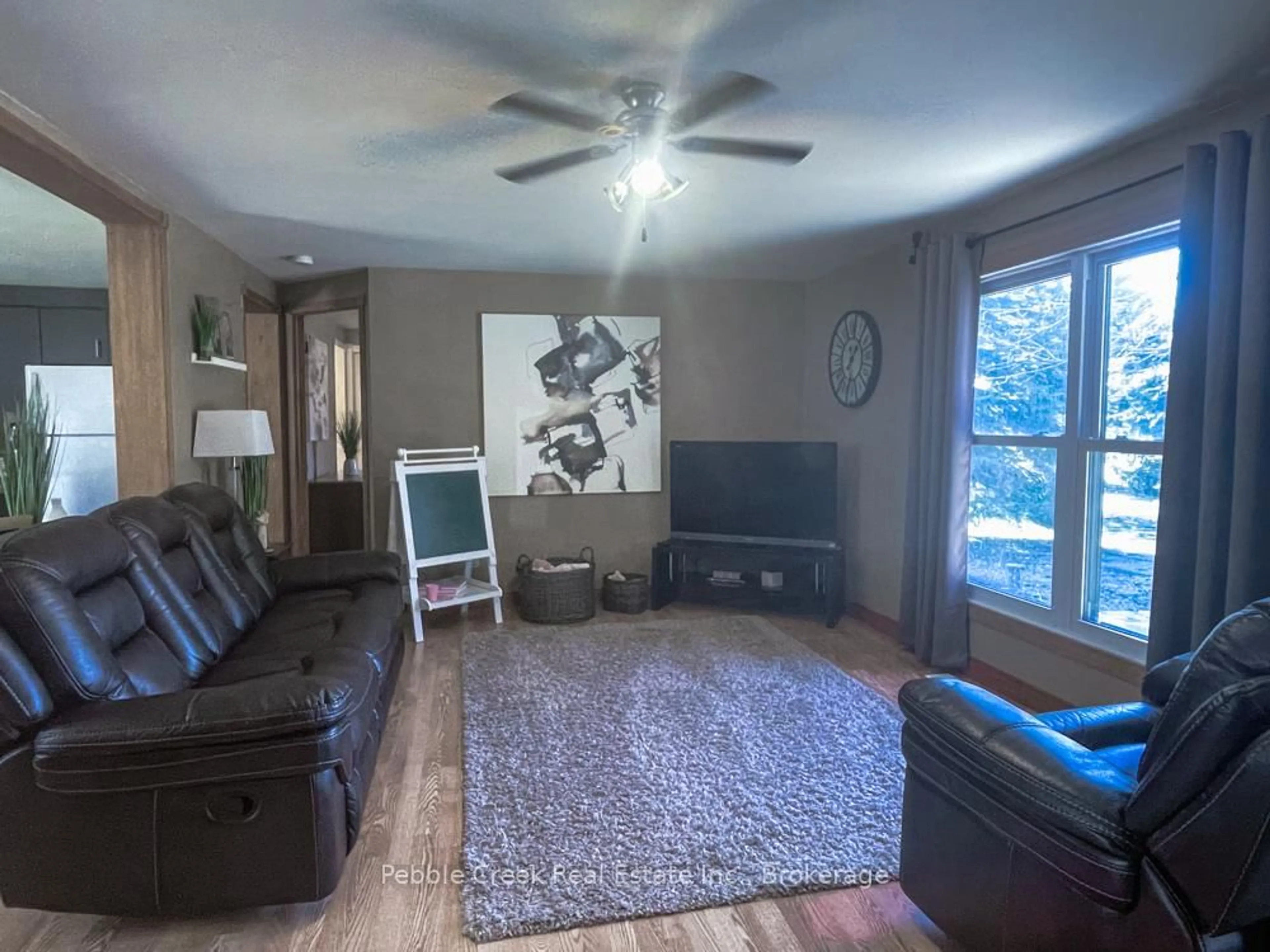 Living room with furniture, wood/laminate floor for 78240 Parr Line, Central Huron Ontario N0M 1L0
