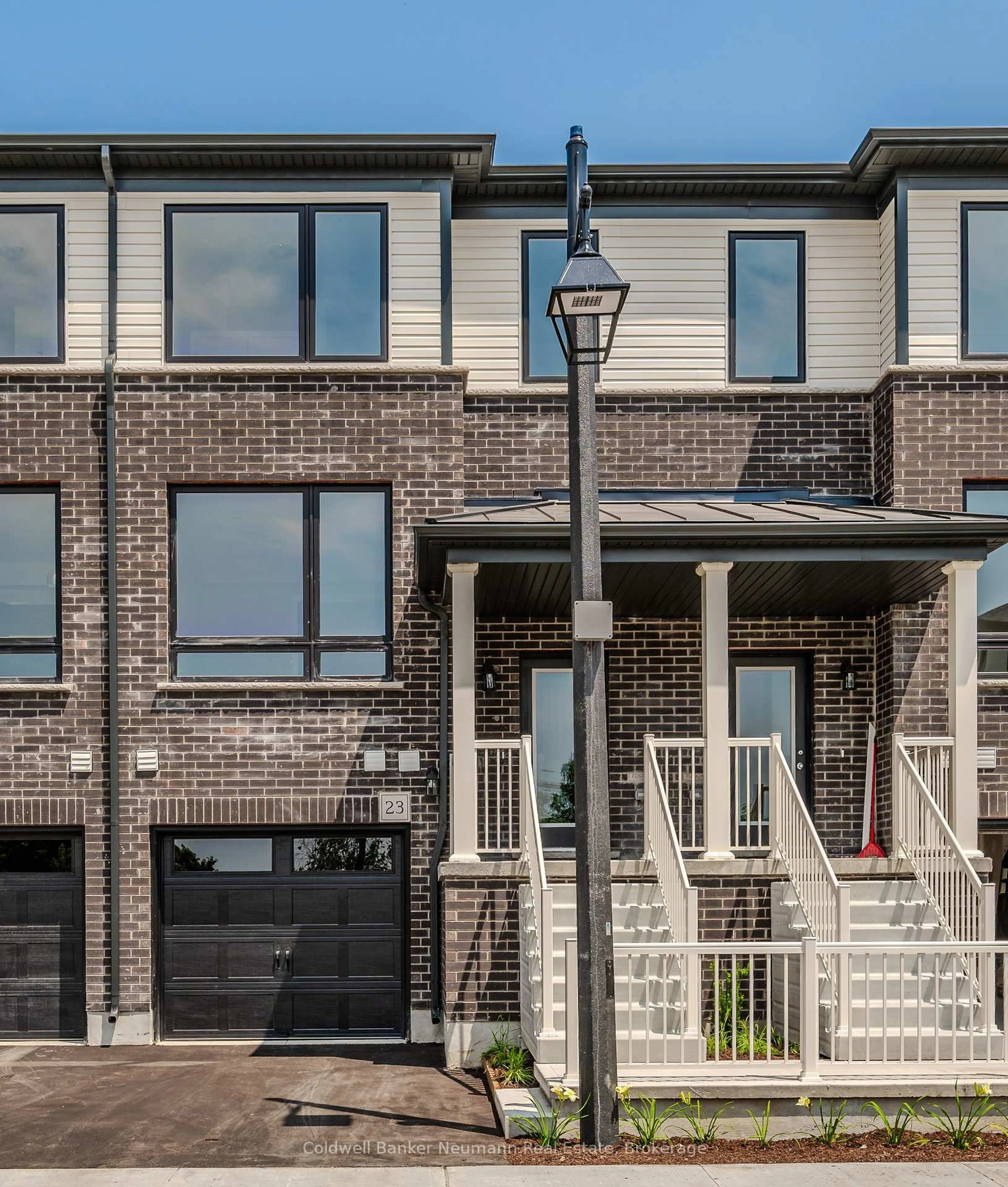 Home with brick exterior material, street for 23 Sora Lane, Guelph Ontario N1E 0T4