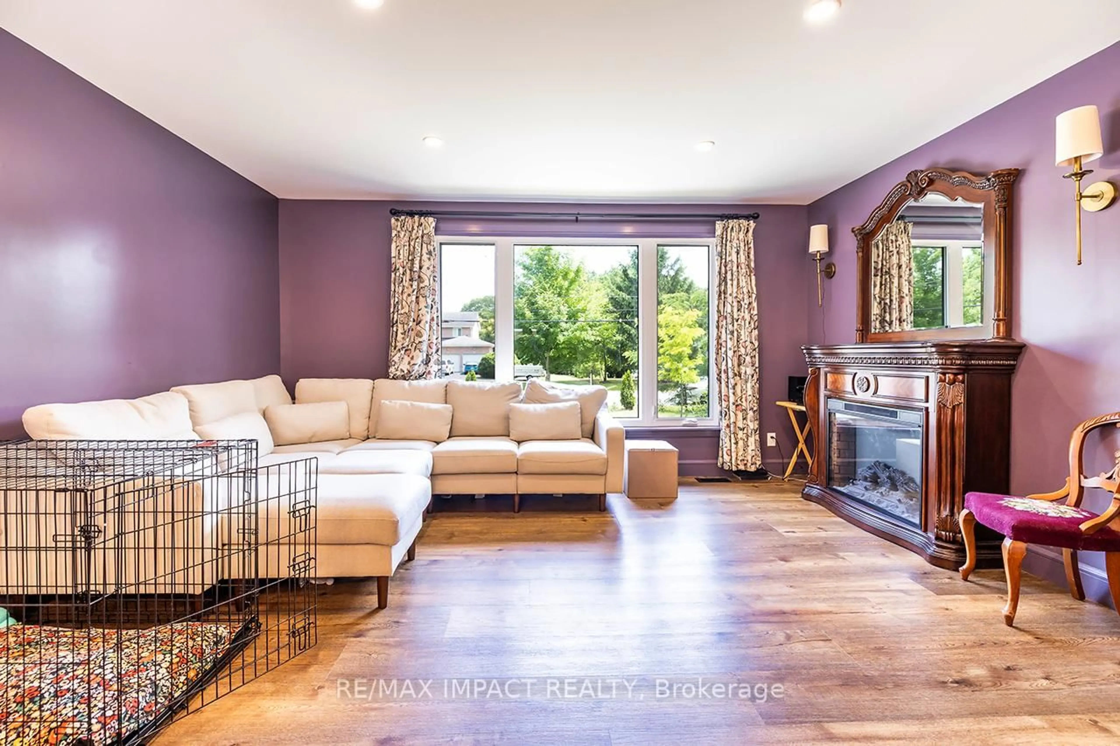 Living room with furniture, wood/laminate floor for 17660 Telephone Rd, Ingleside Ontario K8V 5P4