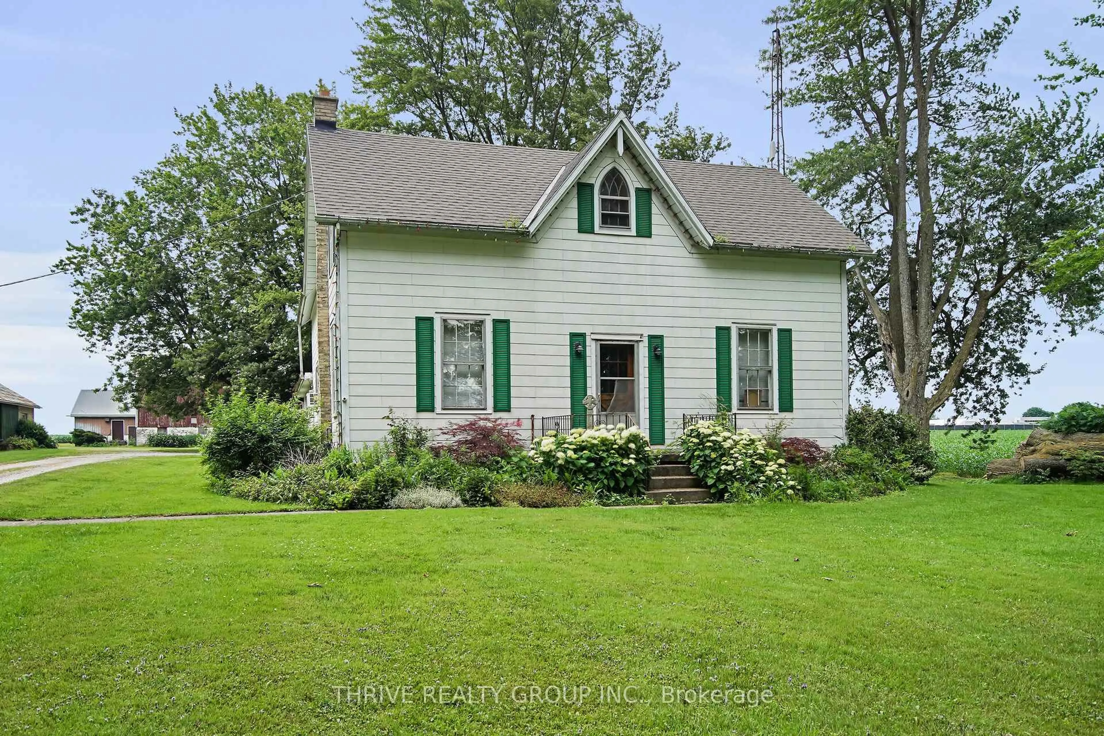 Home with vinyl exterior material, street for 20664 Heritage Rd, Thames Centre Ontario N0M 2P0