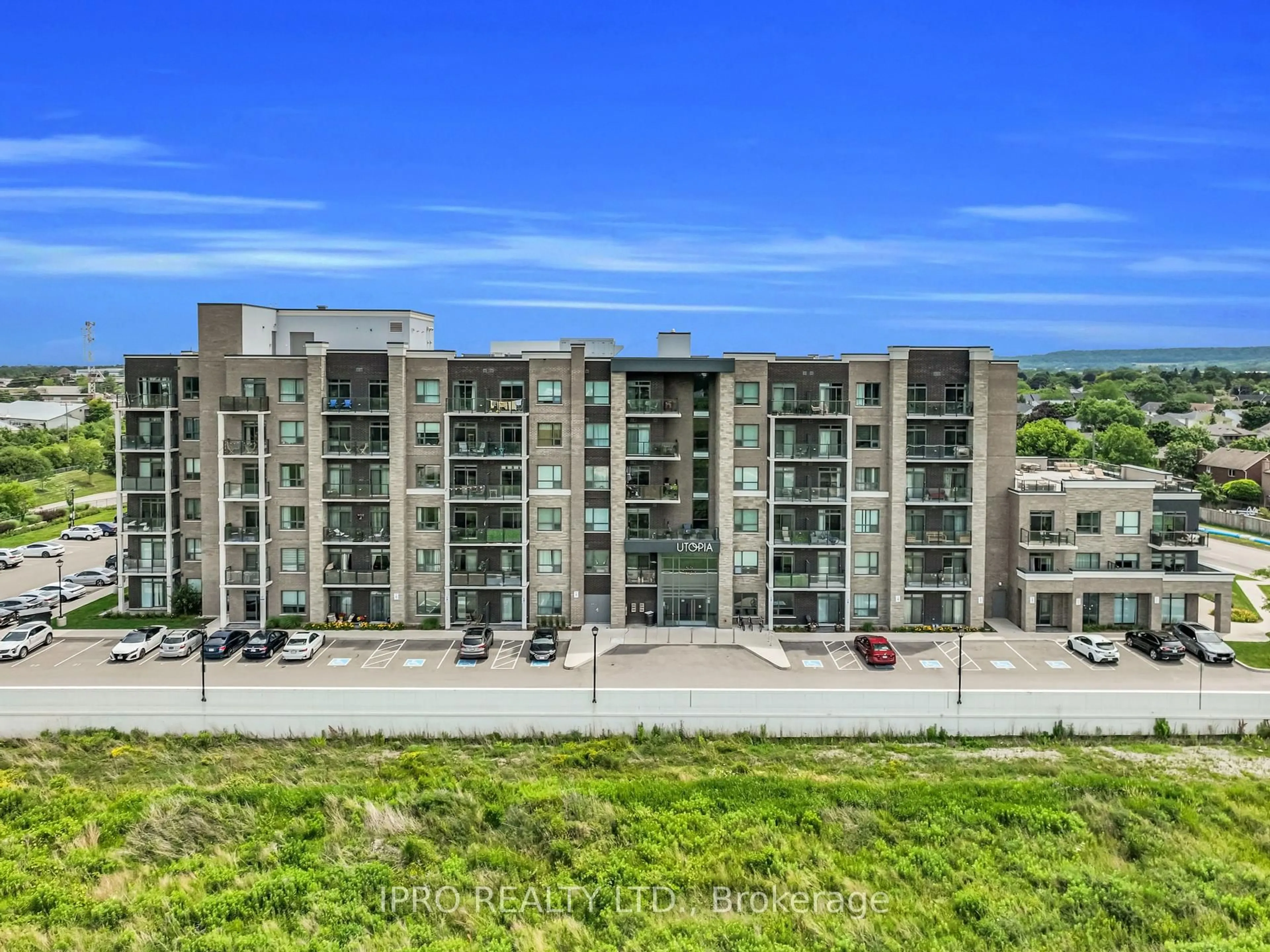 A pic from outside/outdoor area/front of a property/back of a property/a pic from drone, city buildings view from balcony for 5055 Greenlane Rd #208, Lincoln Ontario L3J 2J3