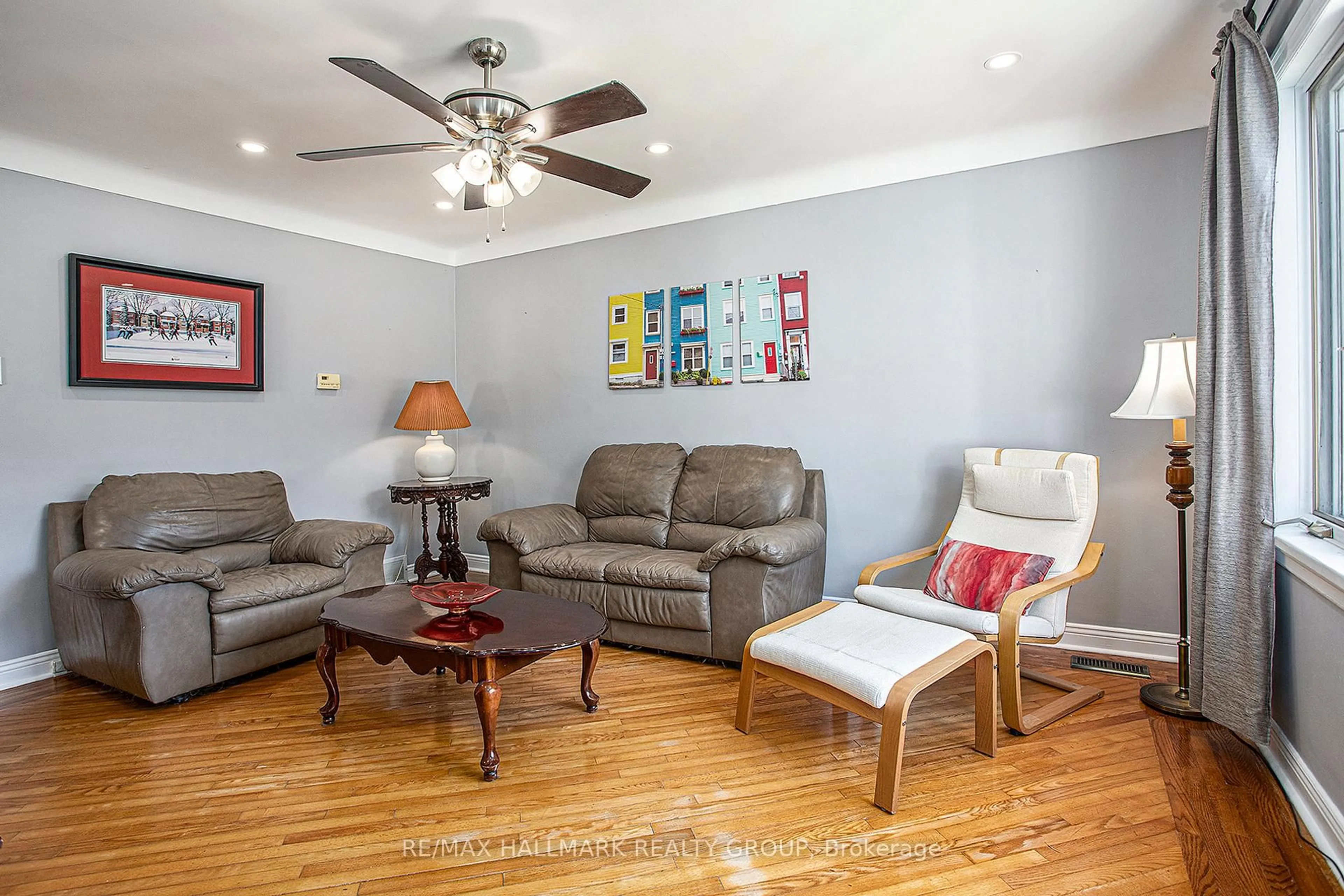 Living room with furniture, wood/laminate floor for 299 Montfort St, Ottawa Ontario K1L 5N7