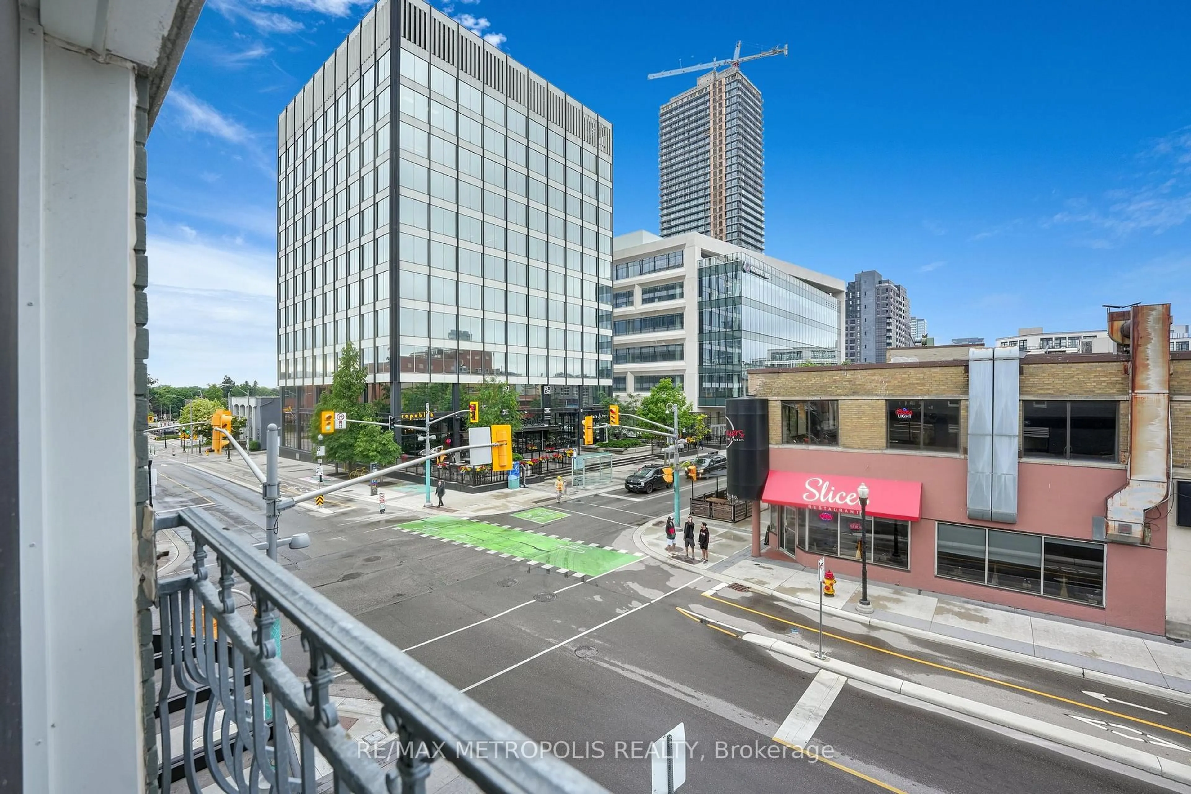 Patio, city buildings view from balcony for 276 King St #207, Kitchener Ontario N2G 1B6