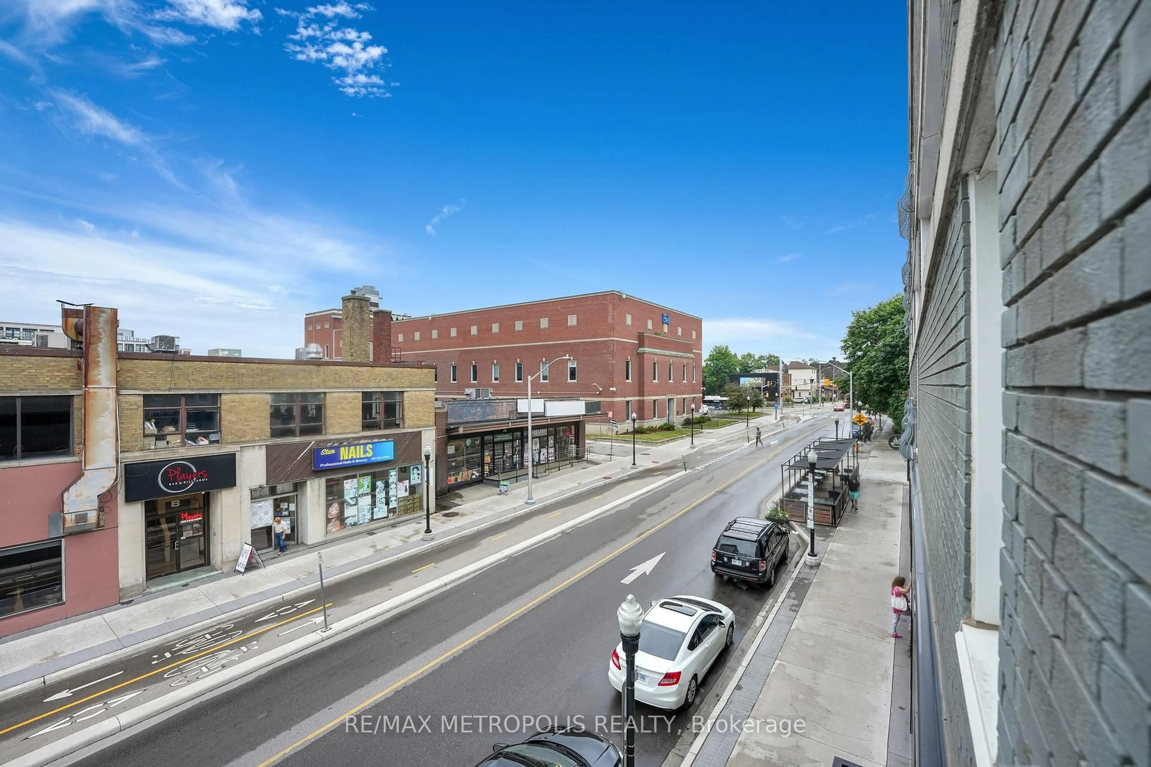 A pic from outside/outdoor area/front of a property/back of a property/a pic from drone, unknown for 276 King St #207, Kitchener Ontario N2G 1B6