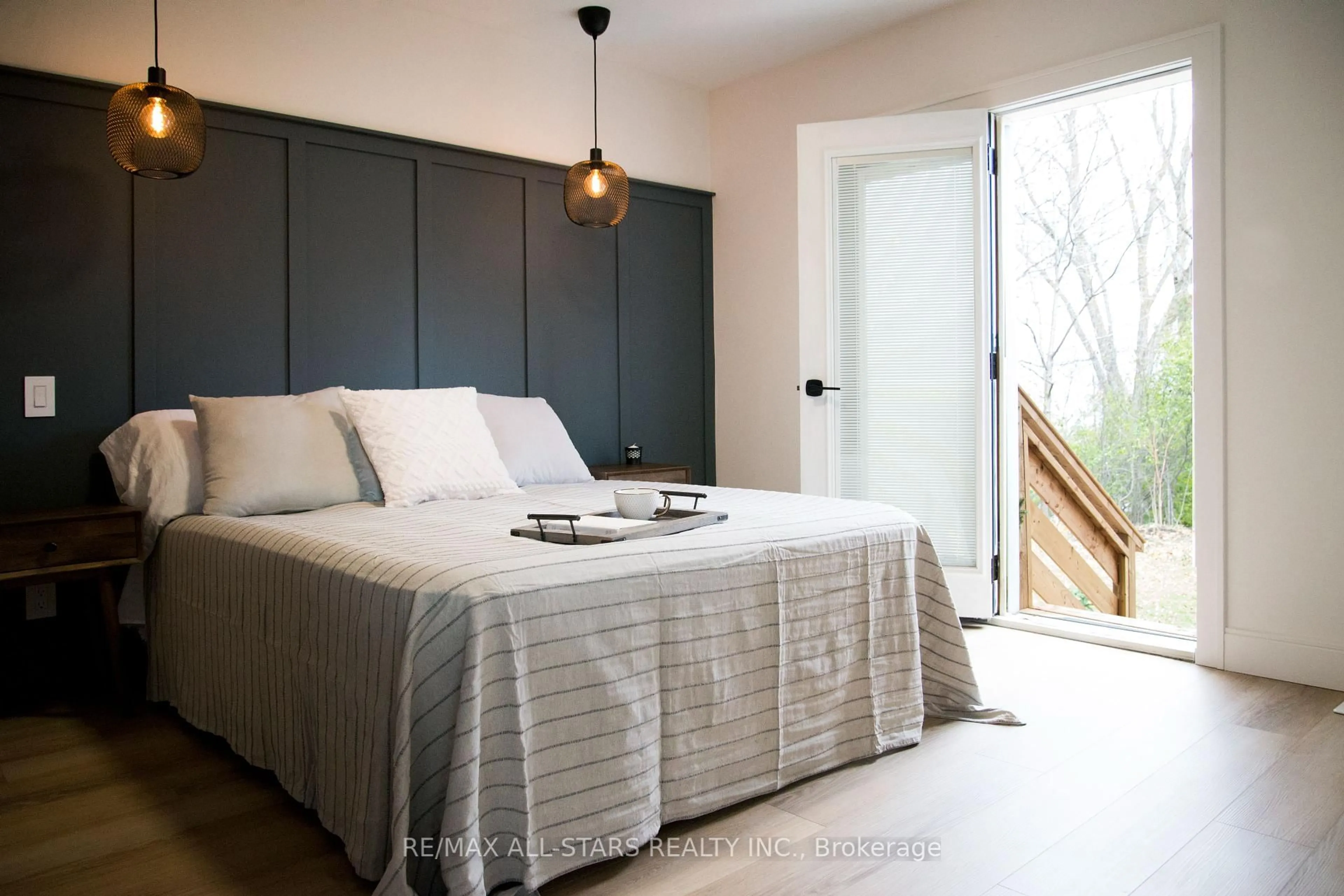Bedroom with bed, wood/laminate floor for 206135 Sykes St, Meaford Ontario N4L 0A7
