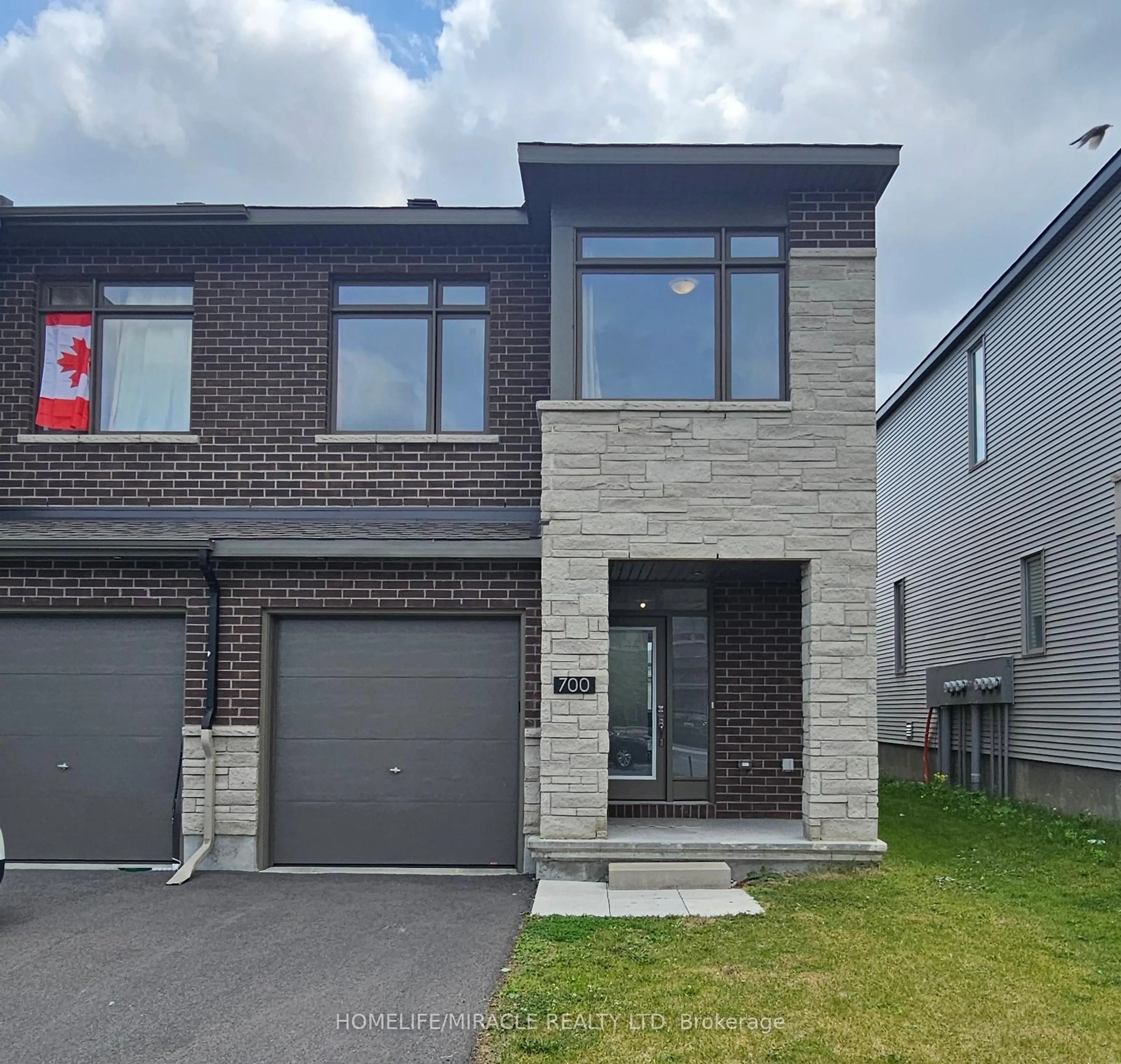 Home with brick exterior material, street for 700 Miikana Rd, Ottawa Ontario K1X 0H7