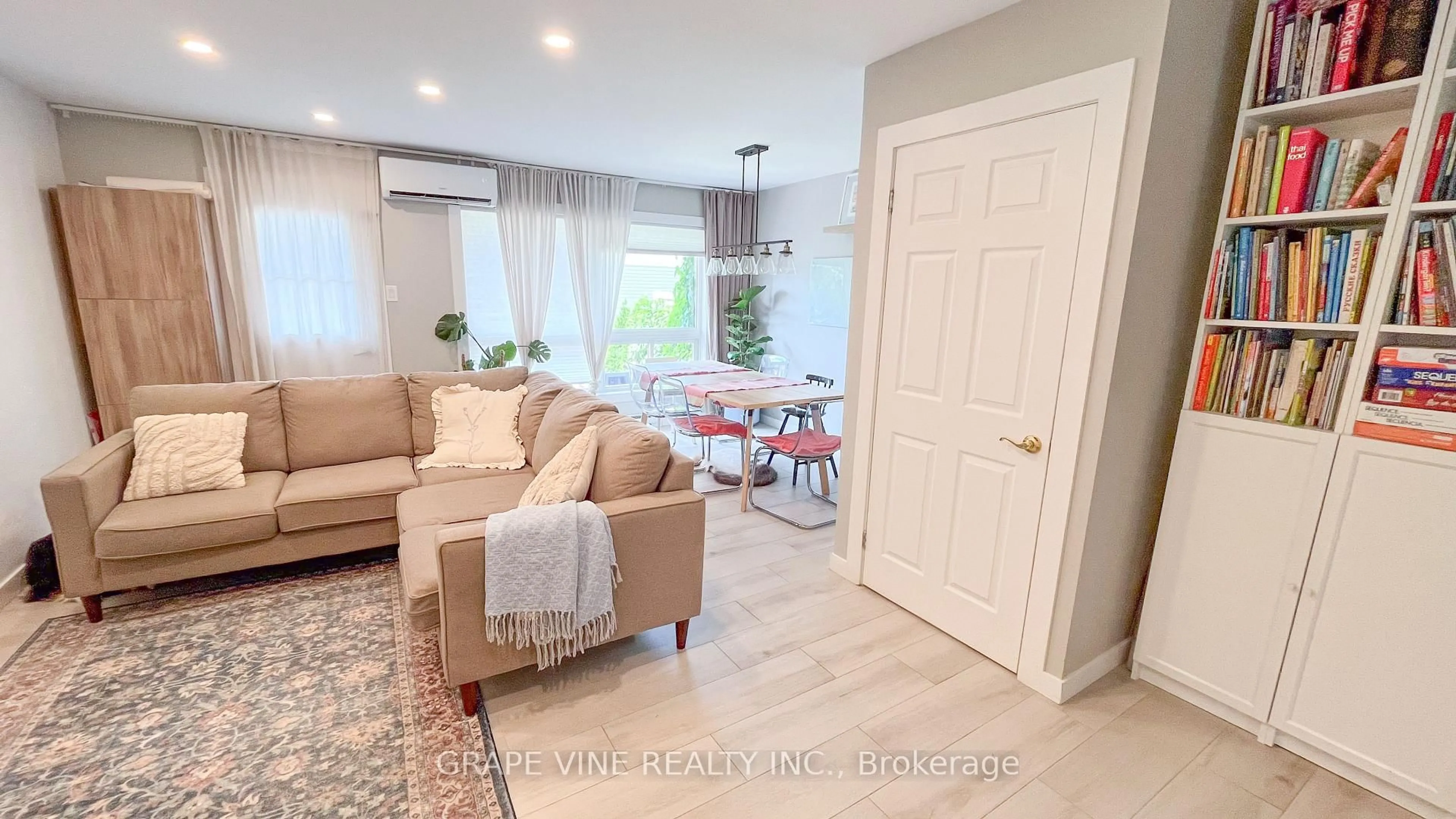 Living room with furniture, wood/laminate floor for 5C Woodvale Green, Ottawa Ontario K2G 4G9