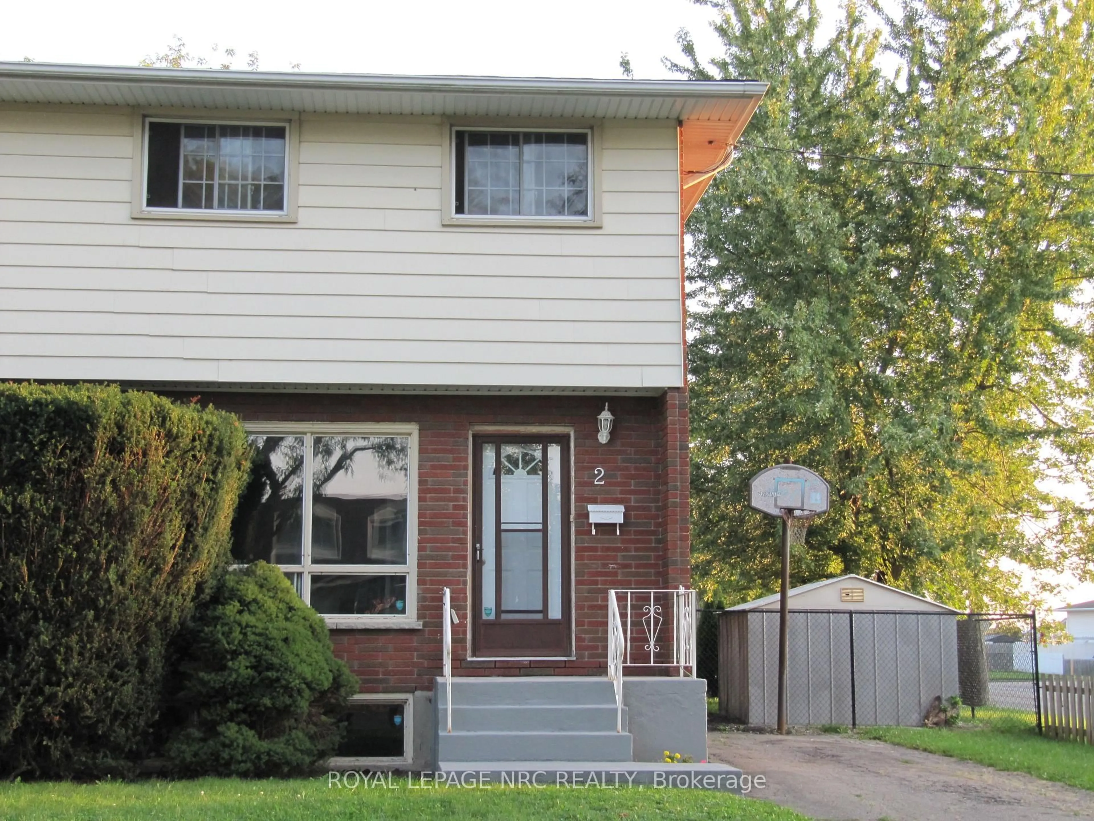 Home with brick exterior material, street for 2 Black Knight Rd, St. Catharines Ontario L2N 3C1