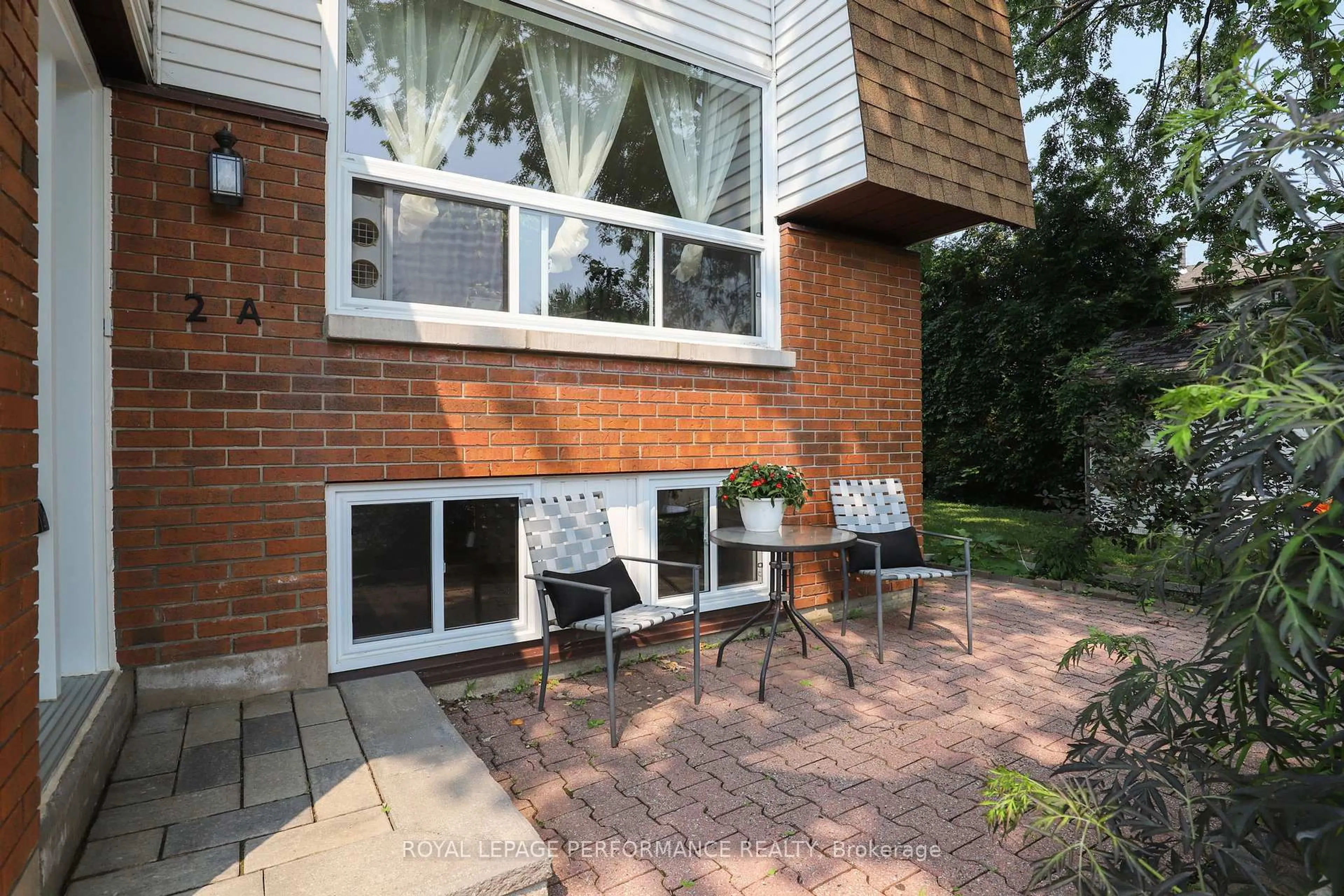 Home with brick exterior material, street for 2 Lovell Lane #A, Ottawa Ontario K2H 9B6