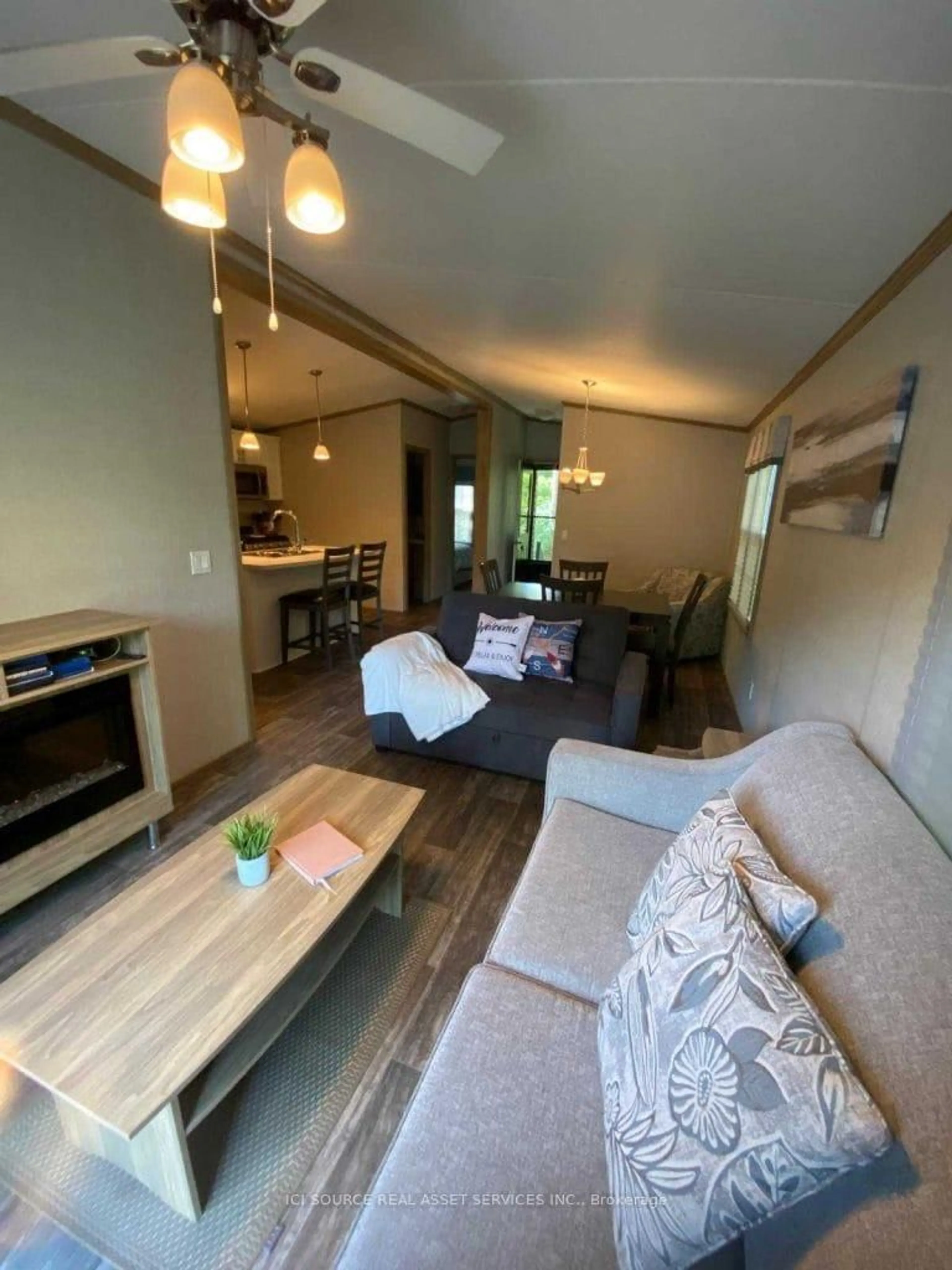 Living room with furniture, wood/laminate floor for 1336 S Morrison Lake Rd #MOR010, Gravenhurst Ontario P0E 1G0