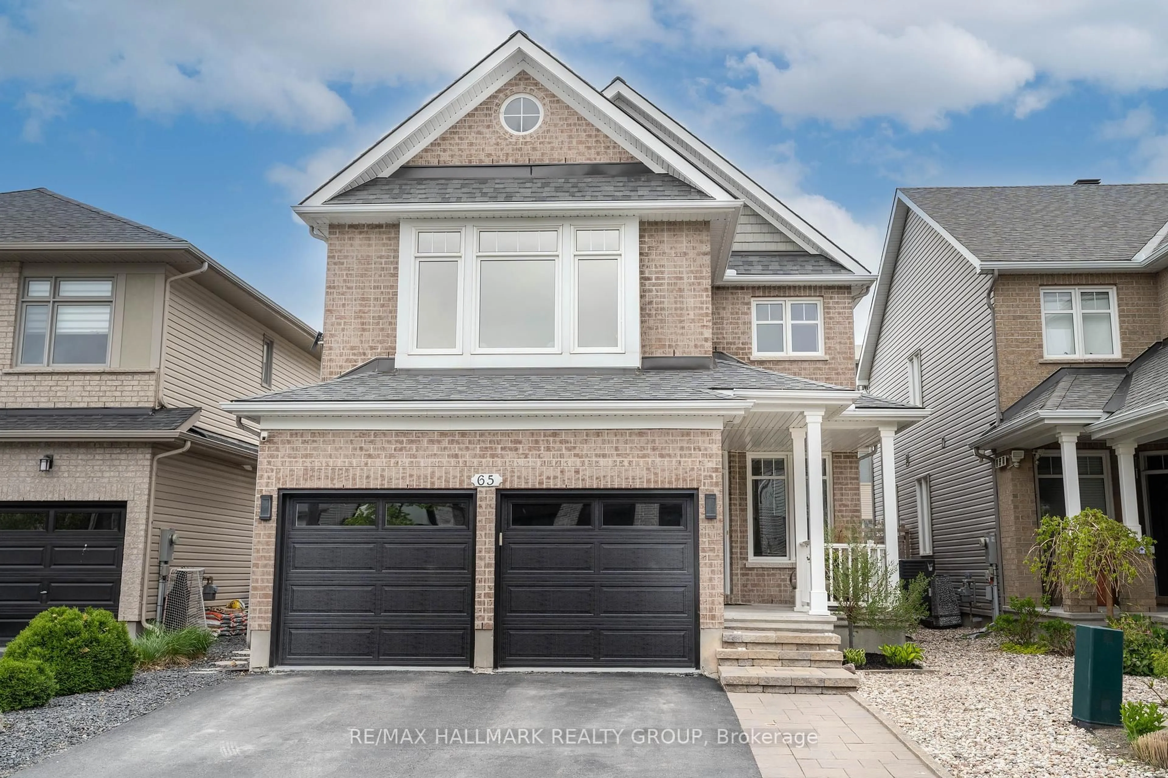 Home with brick exterior material, street for 65 Ginseng Terr, Stittsville Ontario K2V 0B5