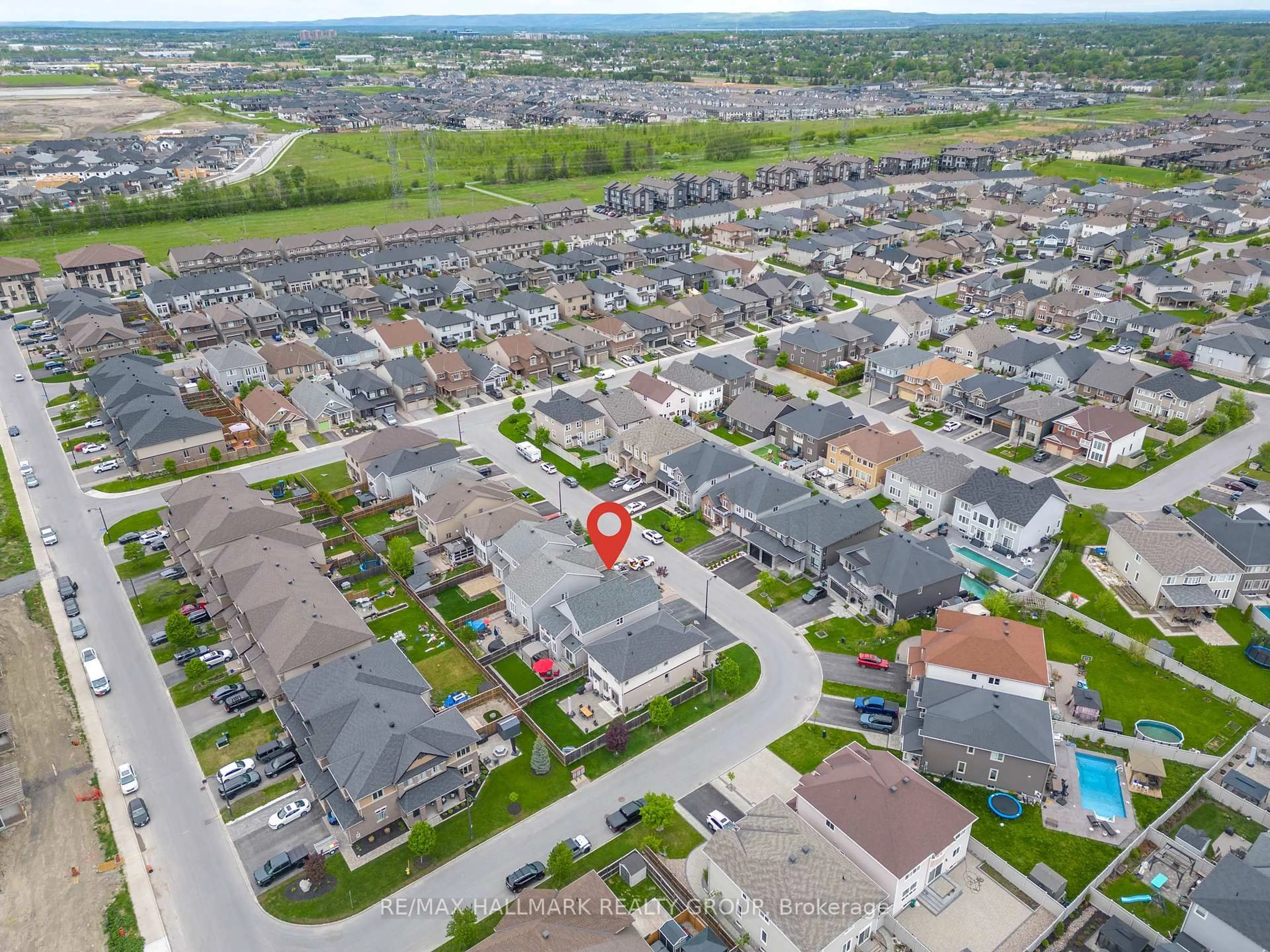 A pic from outside/outdoor area/front of a property/back of a property/a pic from drone, street for 65 Ginseng Terr, Stittsville Ontario K2V 0B5