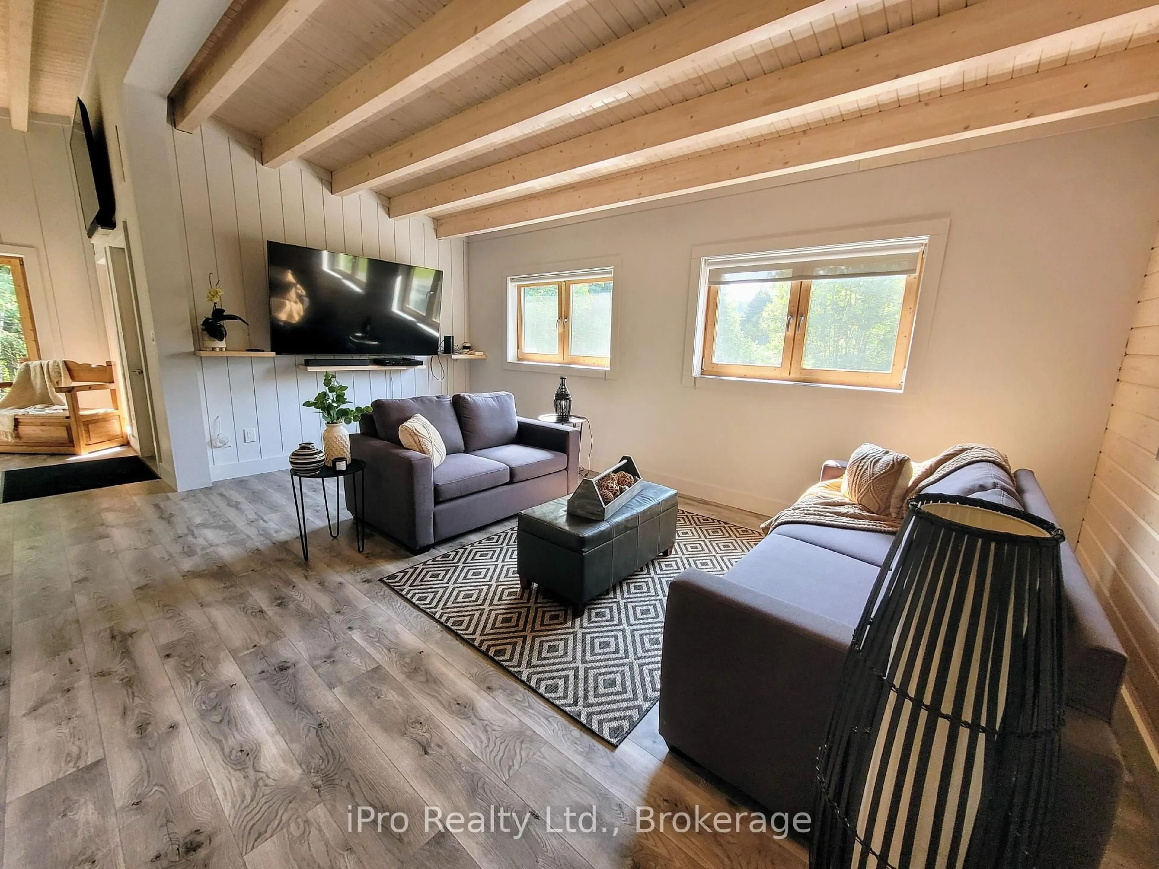 Living room with furniture, wood/laminate floor for 130 Sharpe St, Burk's Falls Ontario P0A 1C0