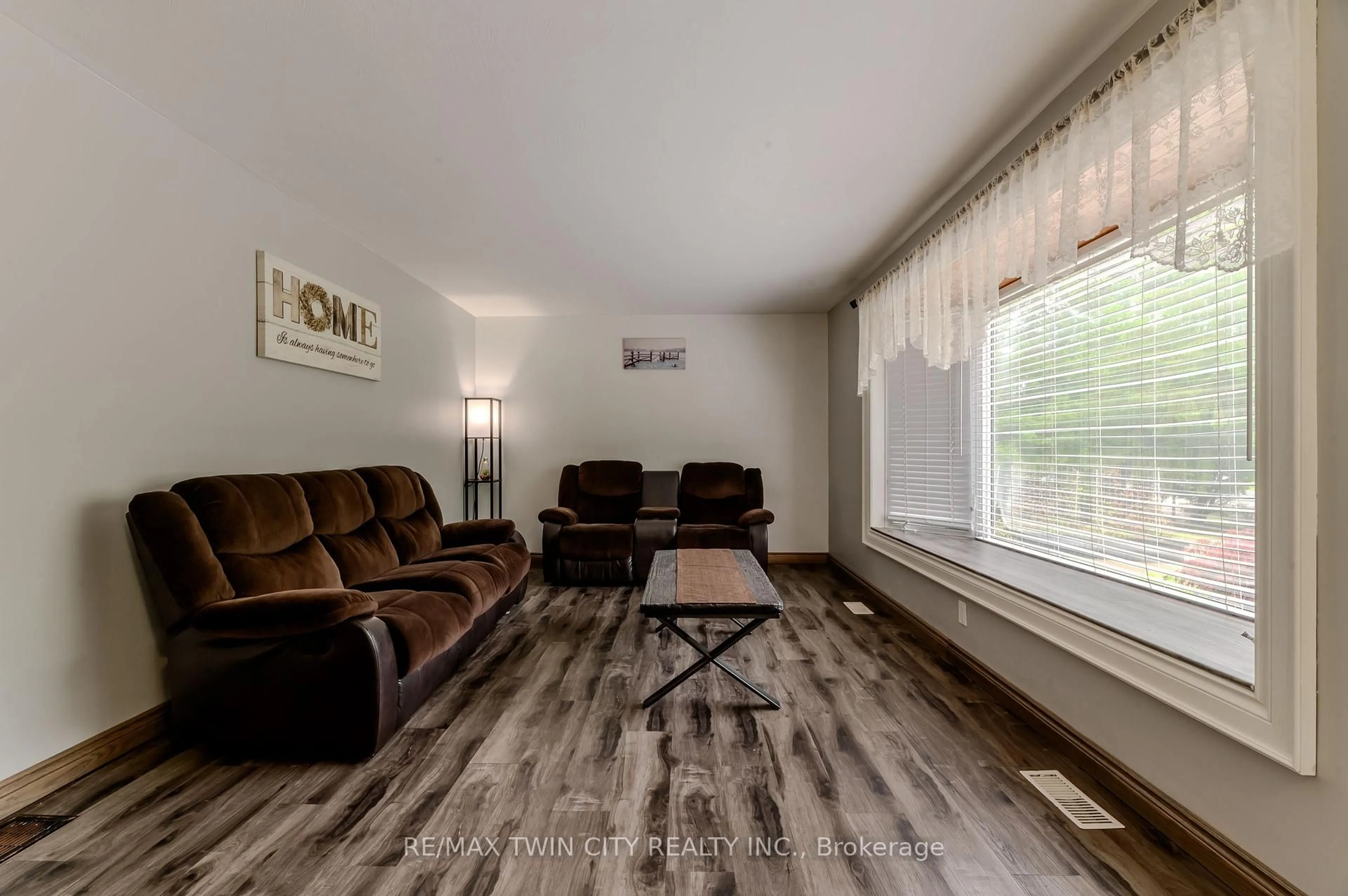Living room with furniture, wood/laminate floor for 936 Windham 11 Rd, Norfolk Ontario N0E 2A0