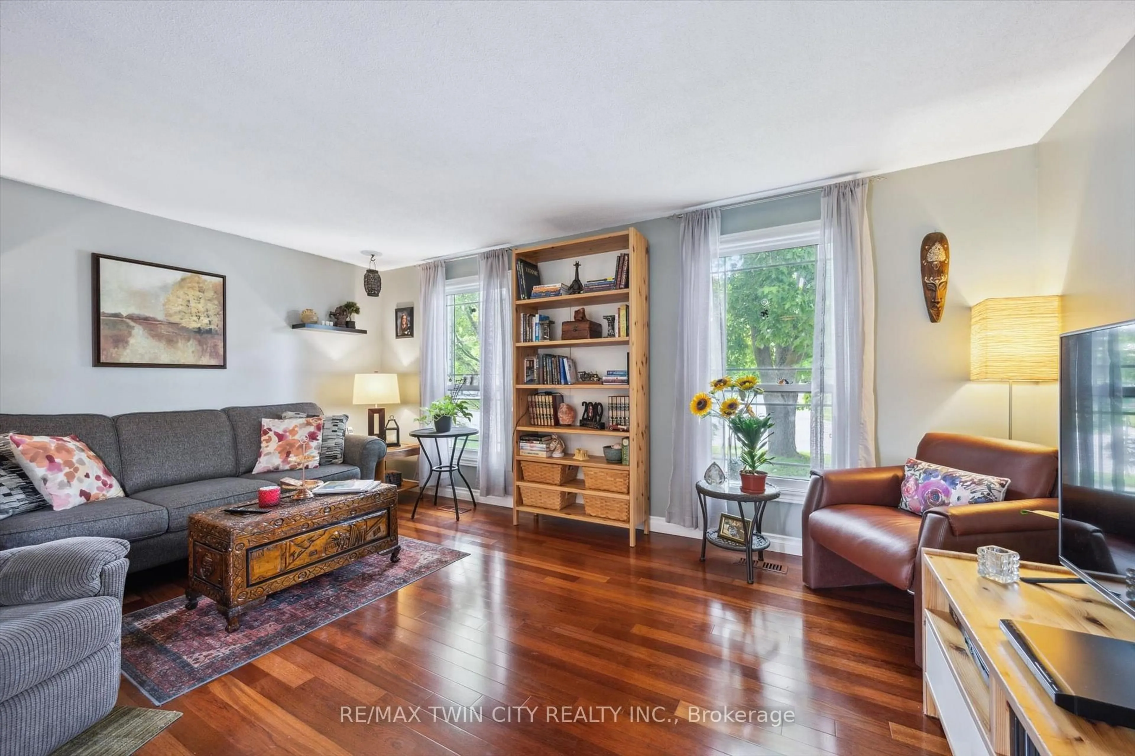 Living room with furniture, wood/laminate floor for 148 NORTHLAKE Dr #A, Waterloo Ontario N2V 1H7