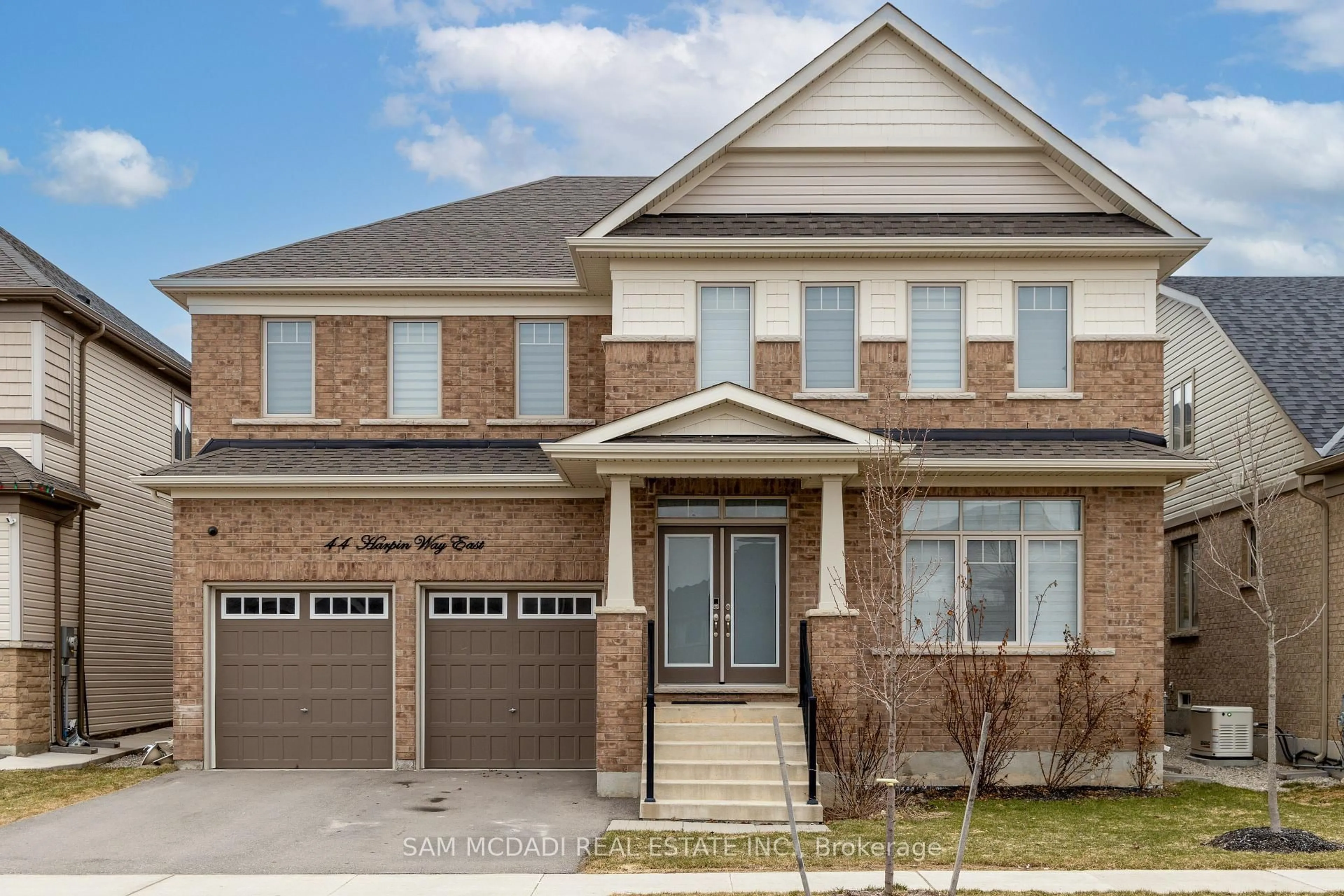 Home with brick exterior material, street for 44 Harpin Way, Centre Wellington Ontario N1M 0H1