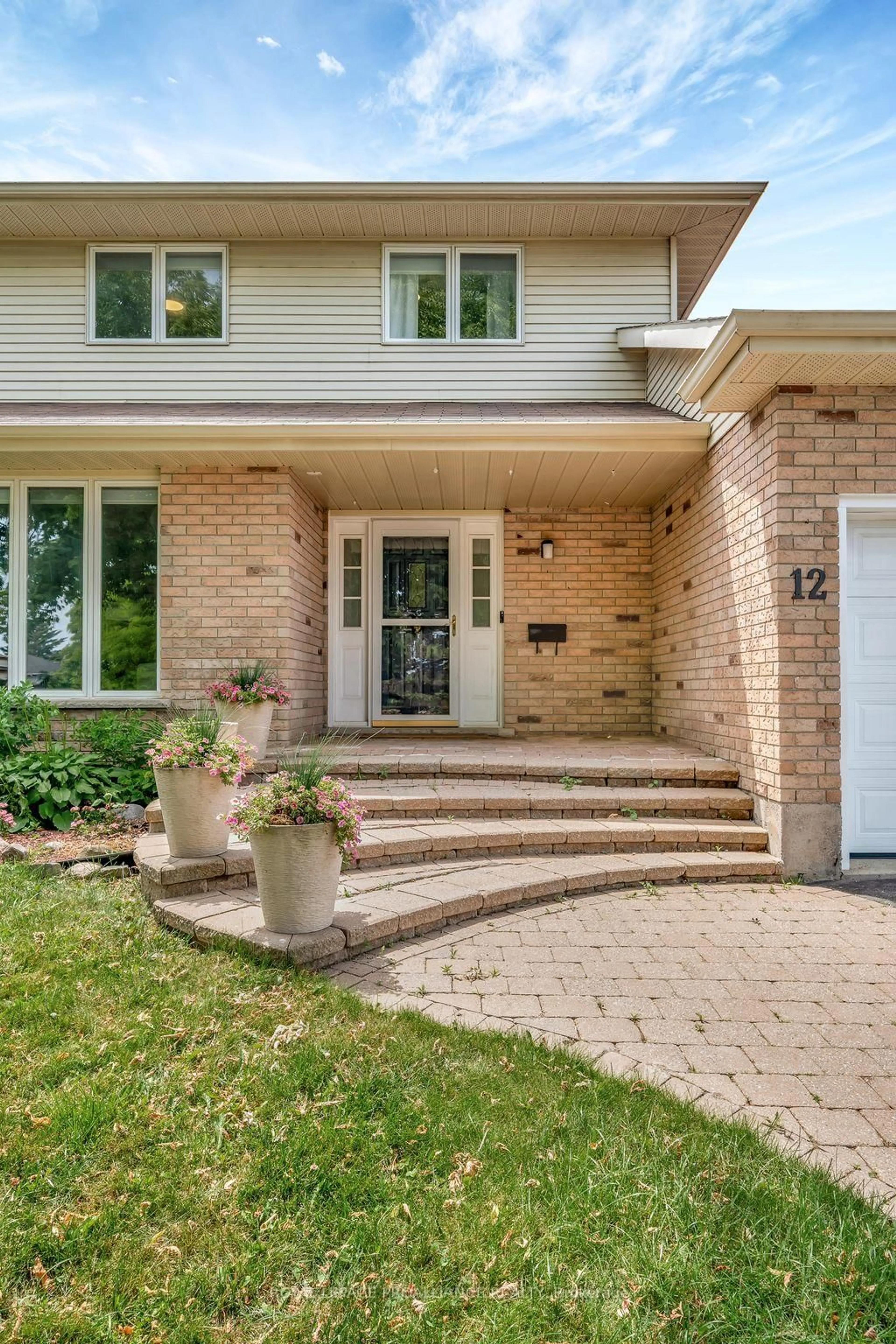 Home with brick exterior material, street for 12 Hastings Dr, Quinte West Ontario K8V 6L3