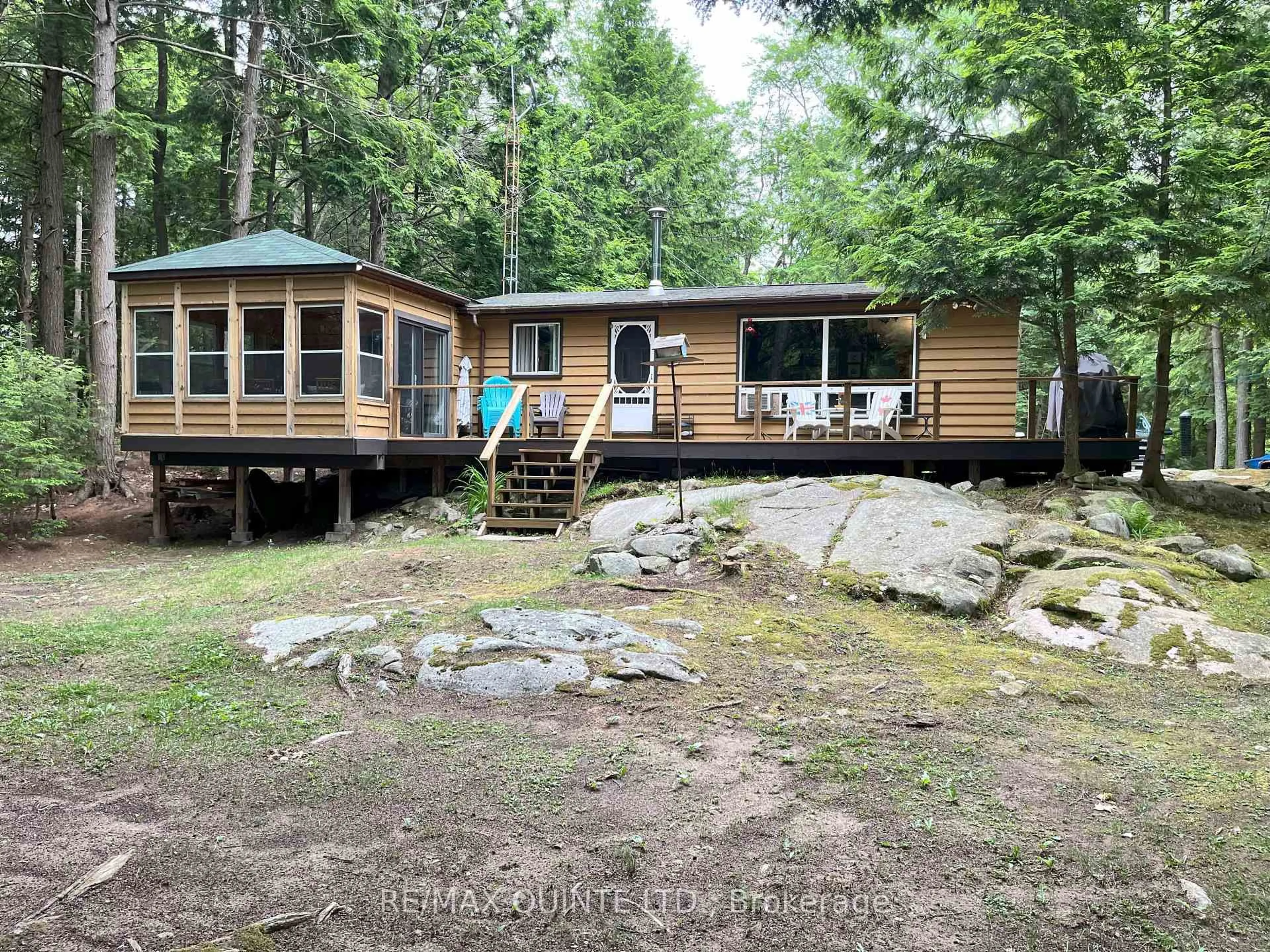 A pic from outside/outdoor area/front of a property/back of a property/a pic from drone, water/lake/river/ocean view for 1549 Gull Lake Lane Lane, Arden Ontario K0H 1B0