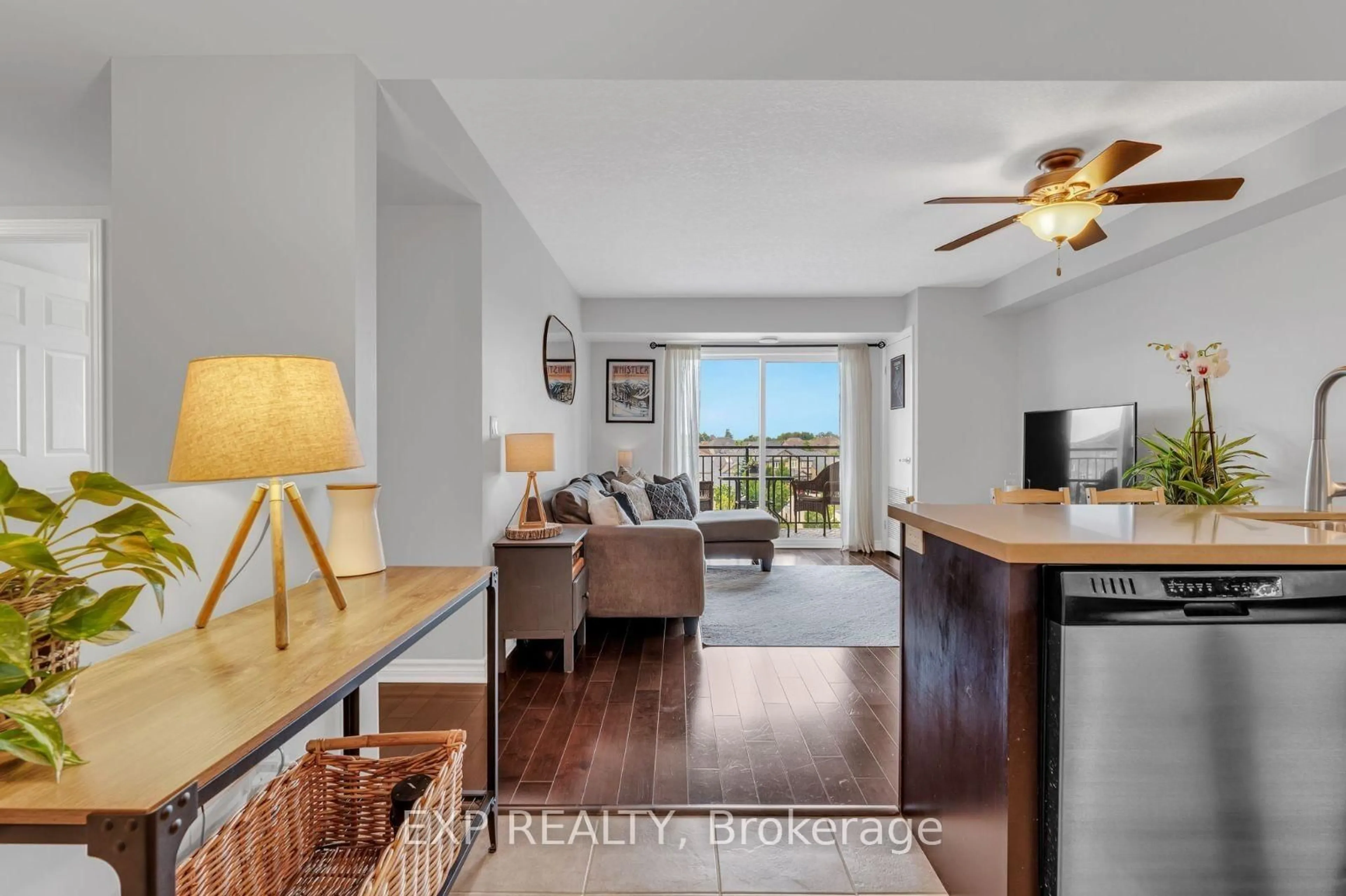 Living room with furniture, wood/laminate floor for 60 Lynnmore St #414, Guelph Ontario N1L 0H6