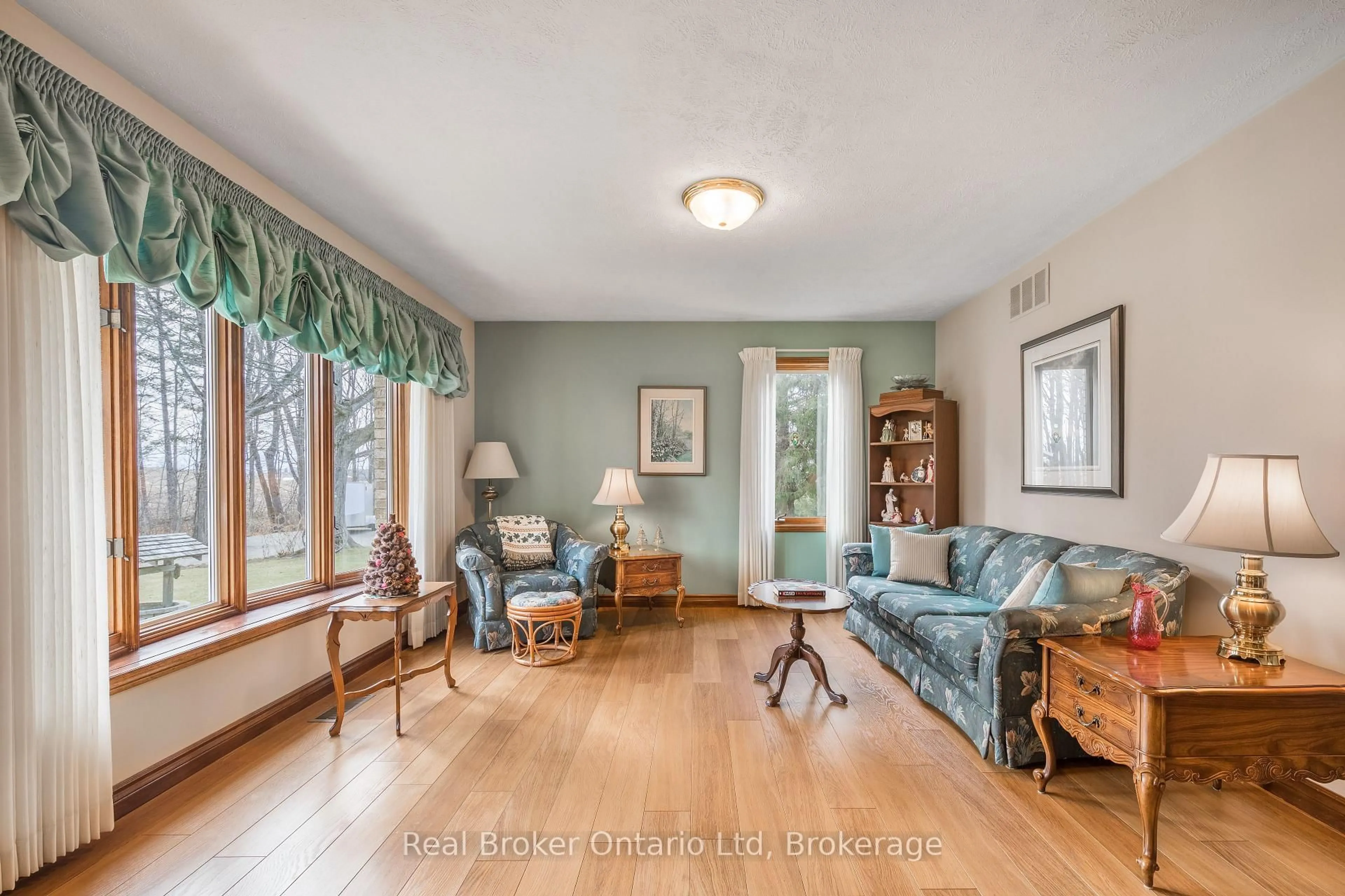Living room with furniture, wood/laminate floor for 203 Sideroad 5, South Bruce Peninsula Ontario N0H 1A0