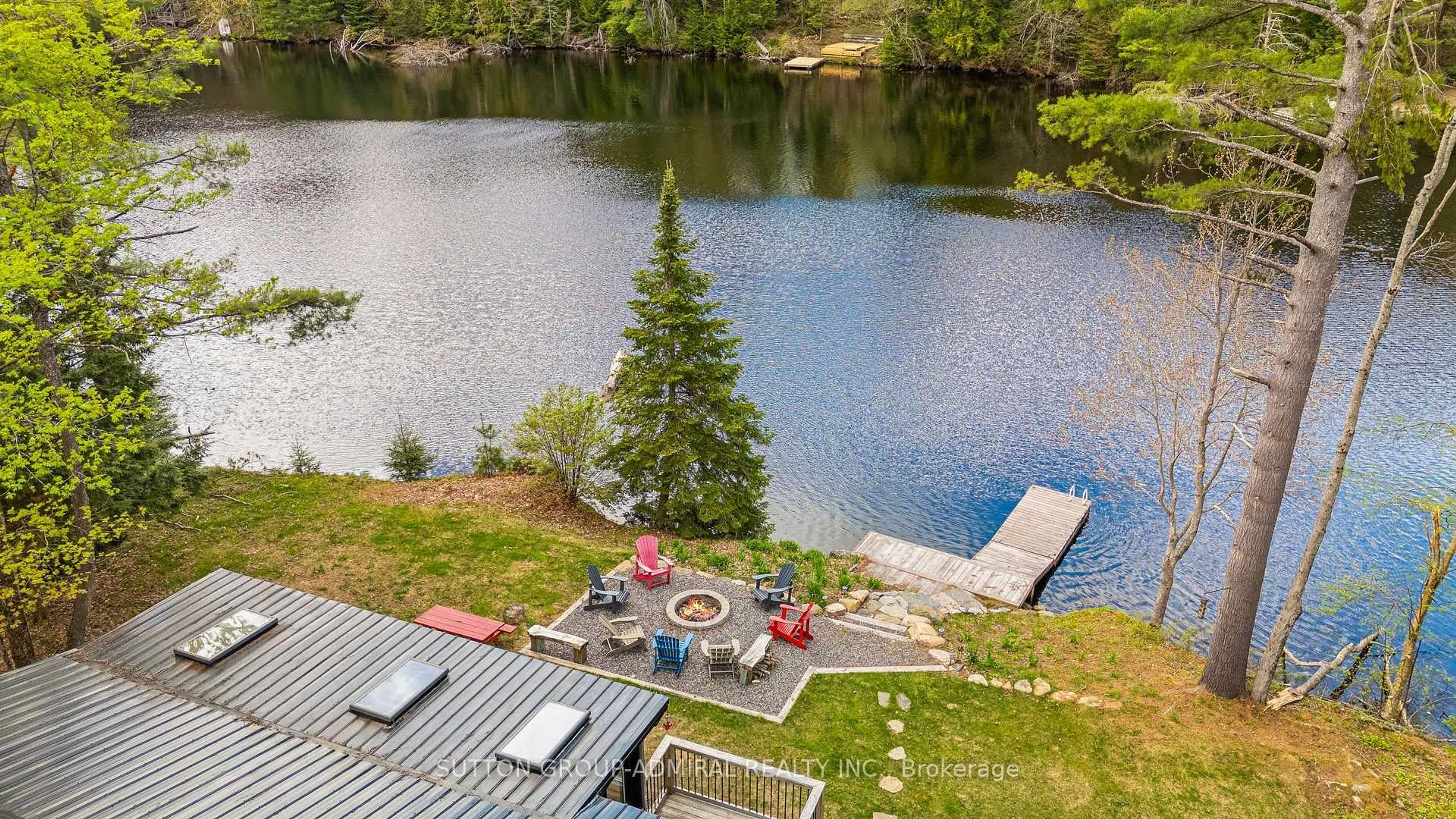 A pic from outside/outdoor area/front of a property/back of a property/a pic from drone, water/lake/river/ocean view for 1023 Kirkpatrick Lane, Bracebridge Ontario P1L 1X1