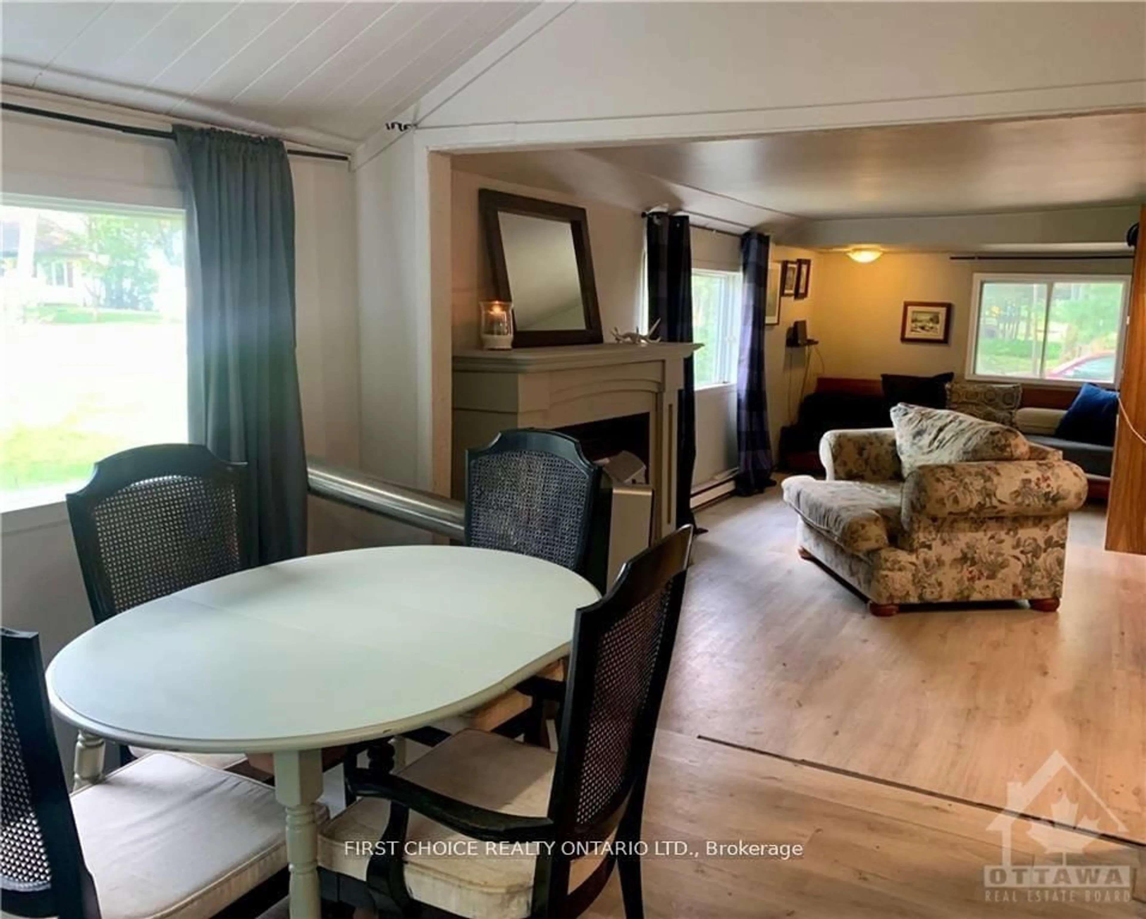 Living room with furniture, wood/laminate floor for 397 Bayview Dr, Ottawa Ontario K0A 3M0