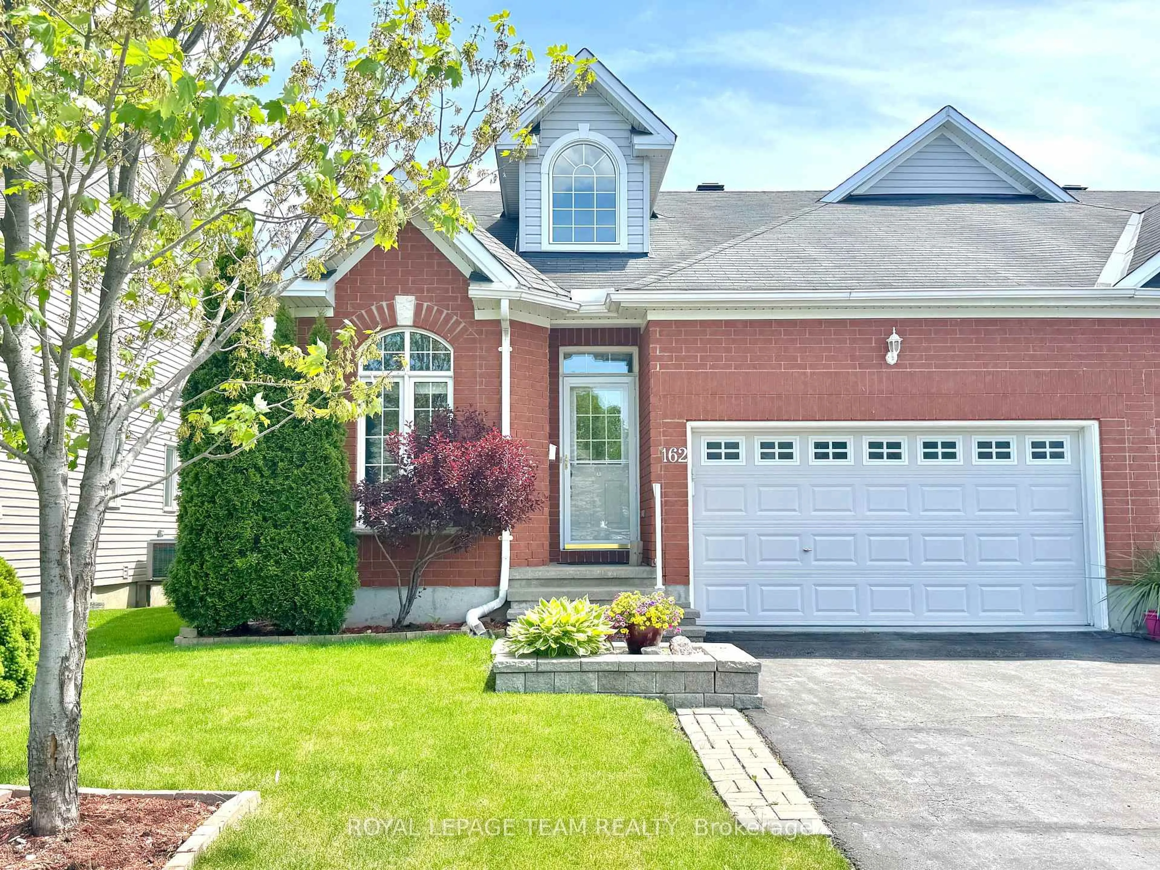 Home with brick exterior material, street for 162 Hartsmere Dr, Ottawa Ontario K2S 2H4