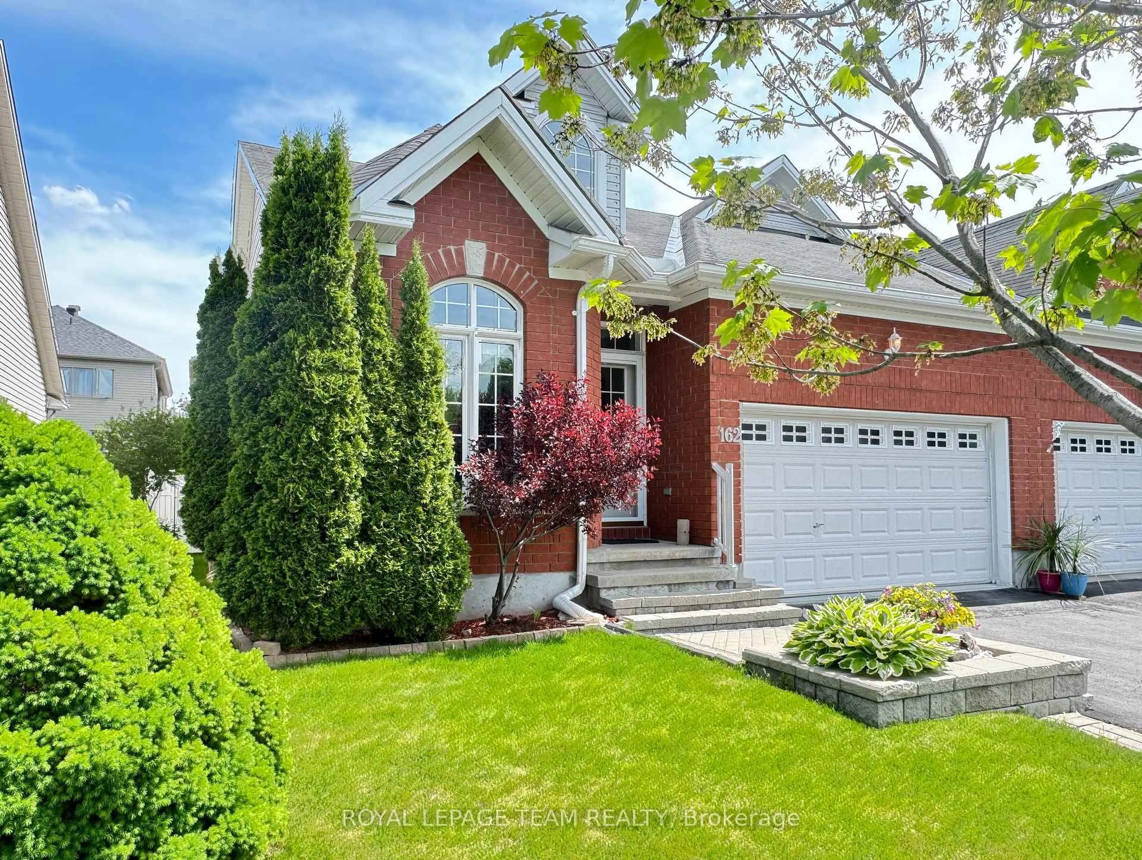 Home with brick exterior material, street for 162 Hartsmere Dr, Ottawa Ontario K2S 2H4