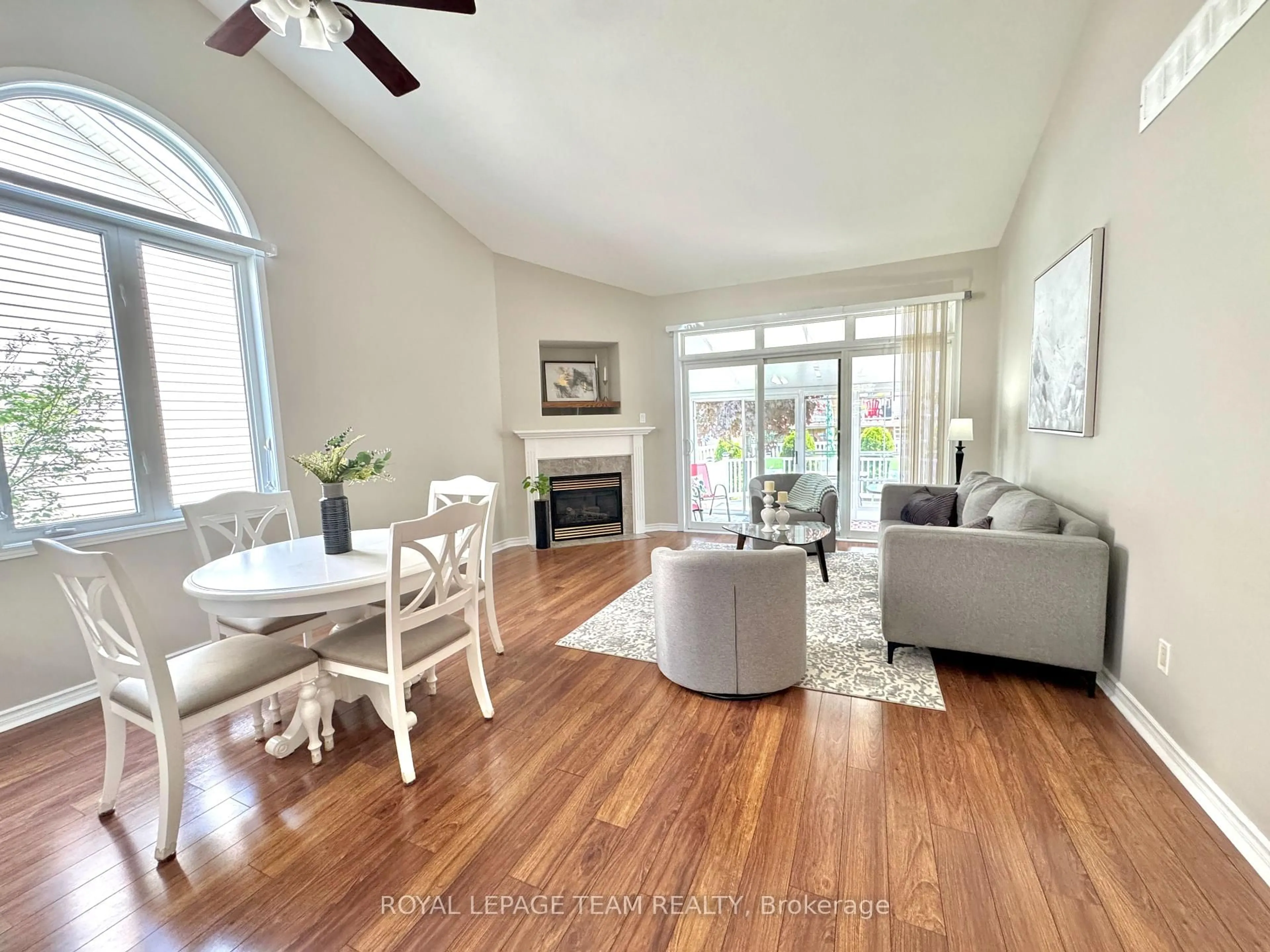 Living room with furniture, wood/laminate floor for 162 Hartsmere Dr, Ottawa Ontario K2S 2H4