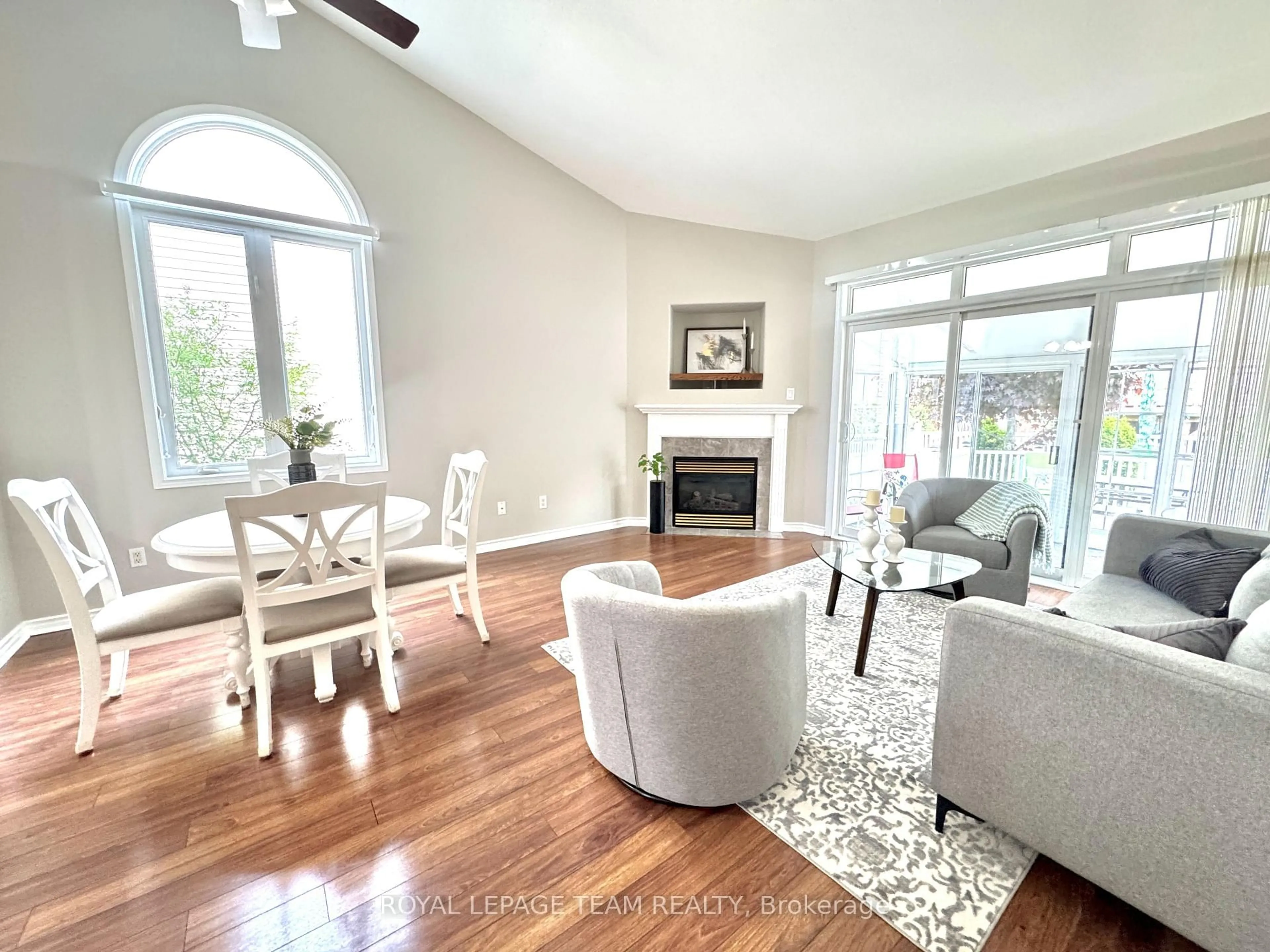 Living room with furniture, wood/laminate floor for 162 Hartsmere Dr, Ottawa Ontario K2S 2H4