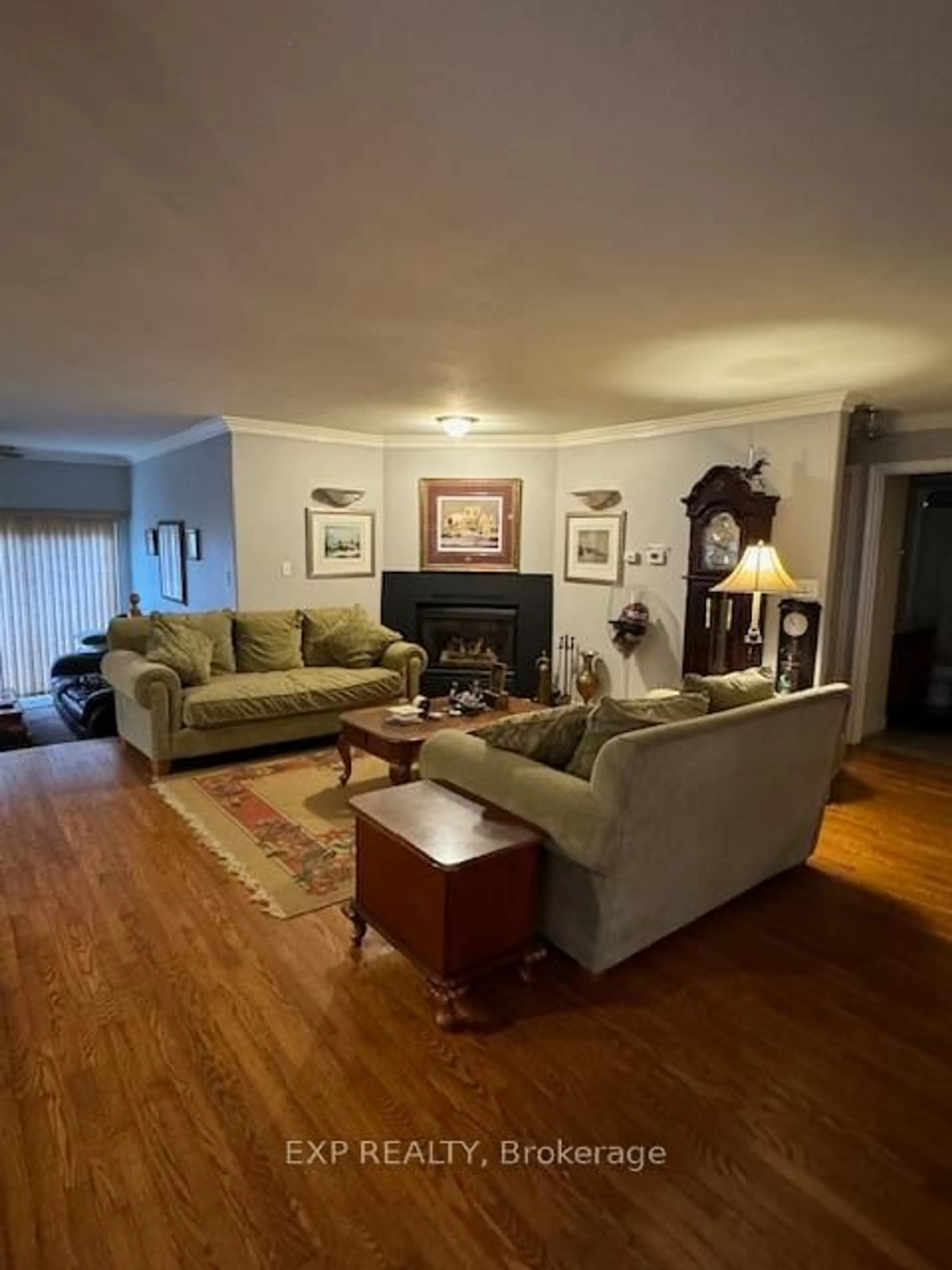 Living room with furniture, wood/laminate floor for 680 Trailview Dr, Peterborough South Ontario K9J 8P1