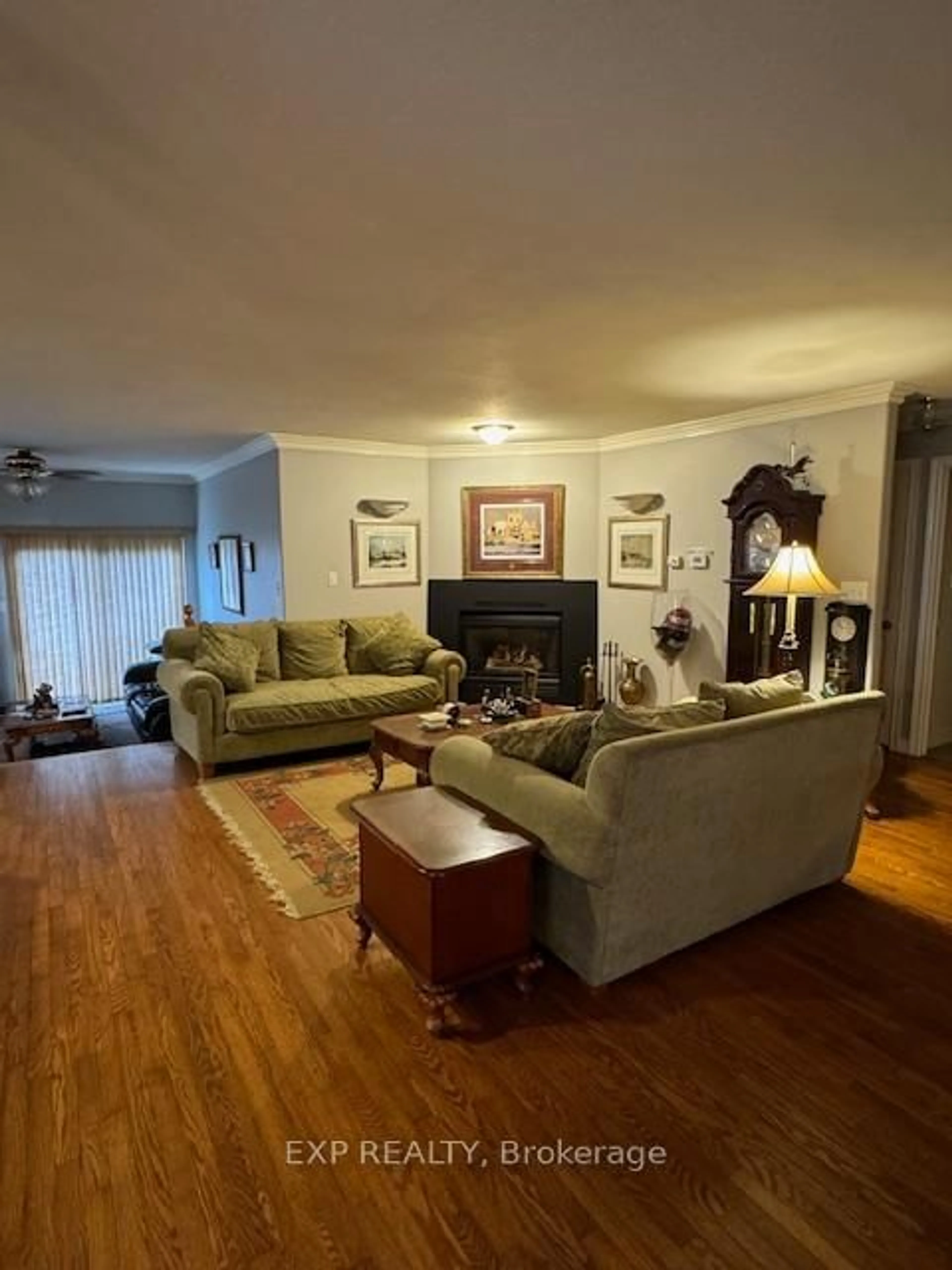 Living room with furniture, wood/laminate floor for 680 Trailview Dr, Peterborough South Ontario K9J 8P1