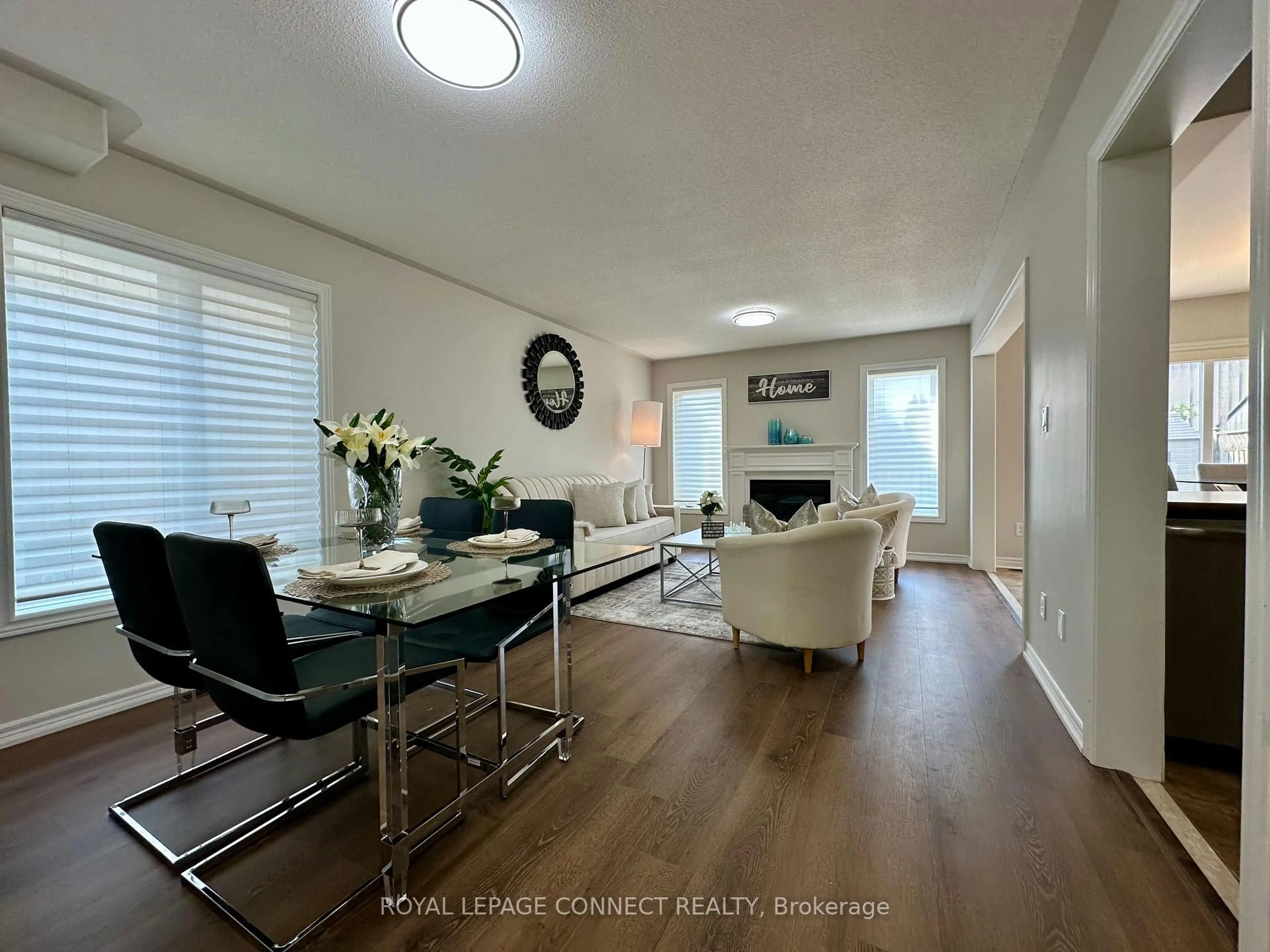 Living room with furniture, wood/laminate floor for 7 Purpledusk Dr, Kawartha Lakes Ontario K9V 0B2