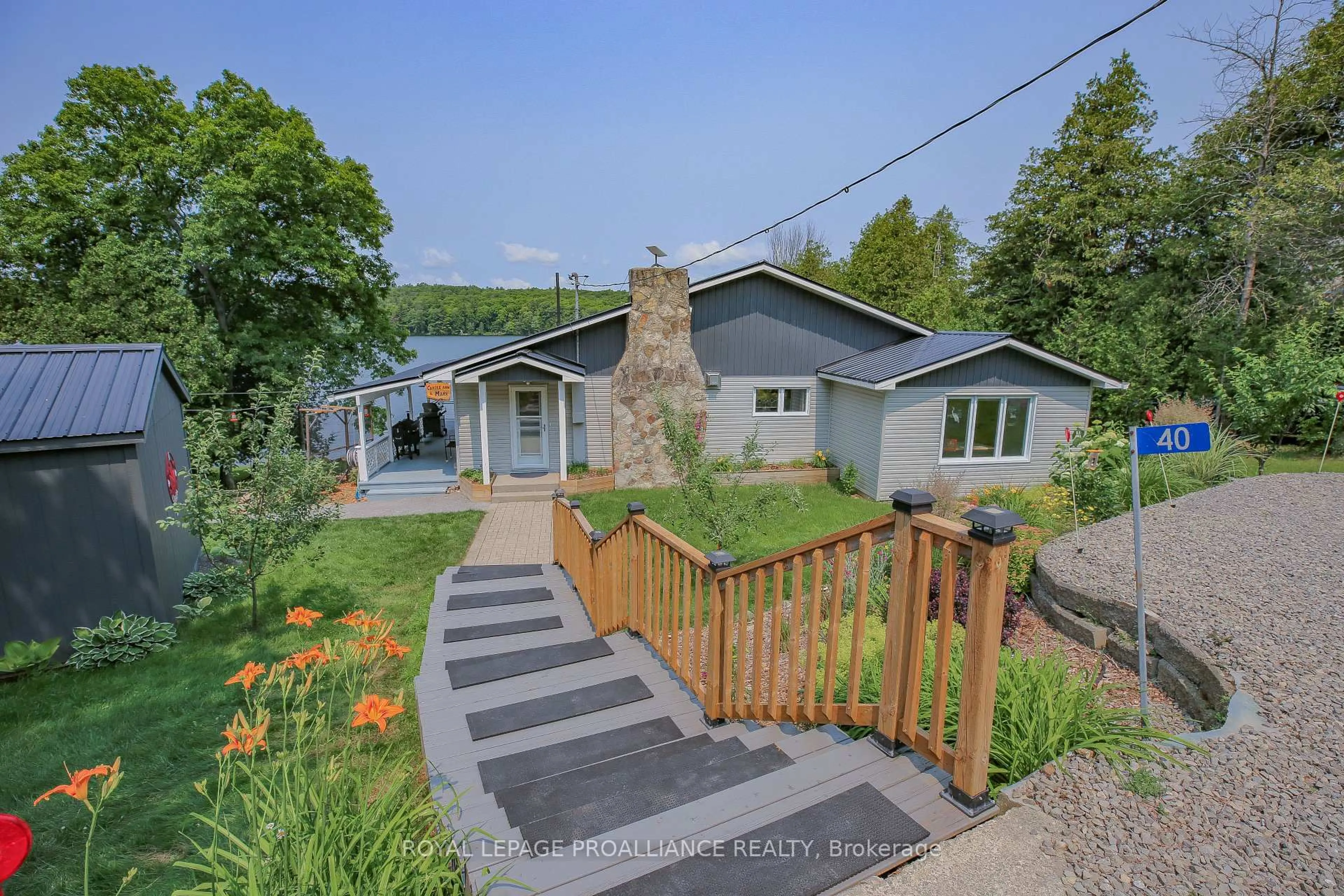 A pic from outside/outdoor area/front of a property/back of a property/a pic from drone, water/lake/river/ocean view for 40 Chant Terr, Front of Yonge Ontario K0E 1R0