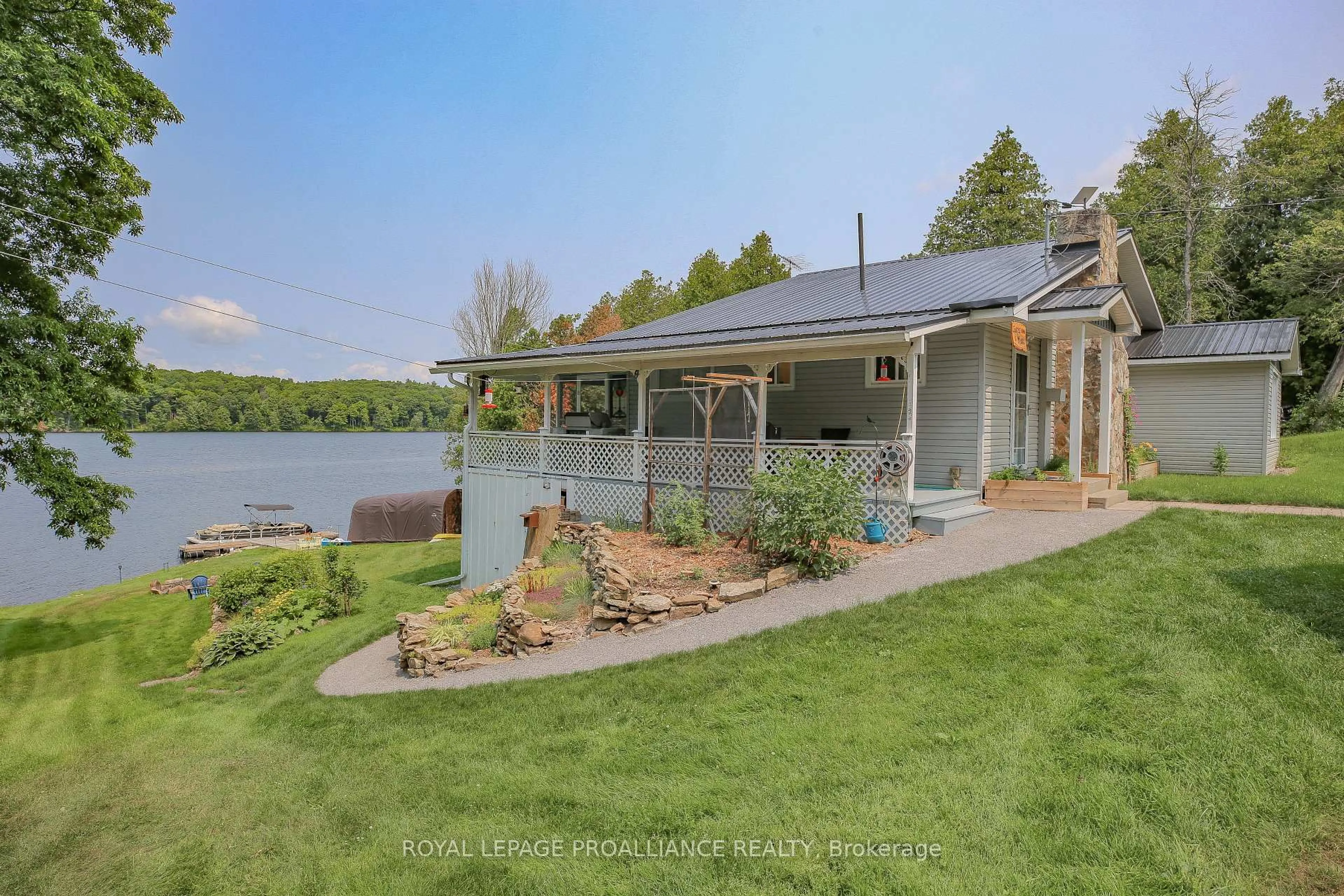 A pic from outside/outdoor area/front of a property/back of a property/a pic from drone, water/lake/river/ocean view for 40 Chant Terr, Front of Yonge Ontario K0E 1R0