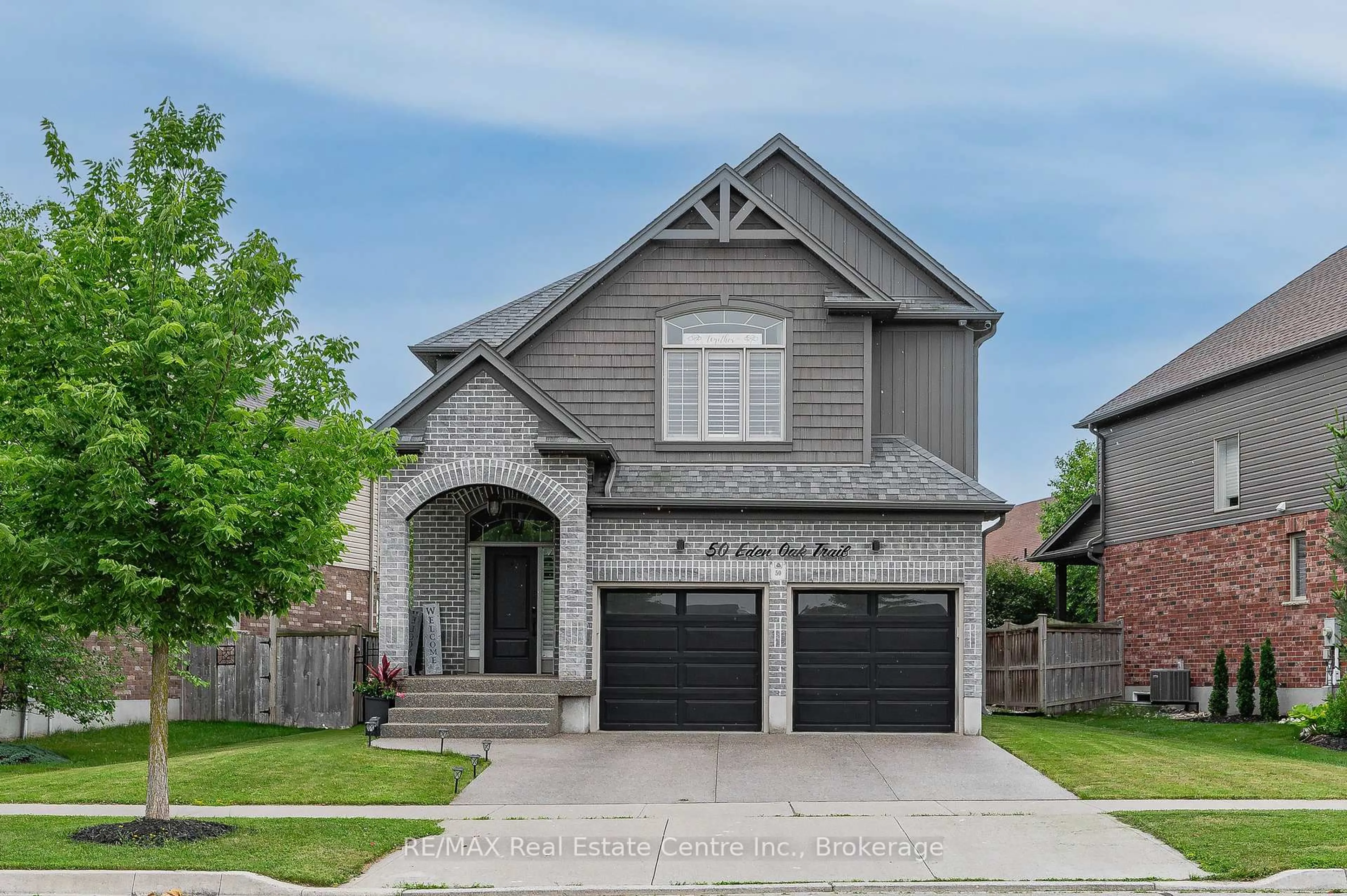 Home with brick exterior material, street for 50 Eden Oak Tr, Kitchener Ontario N2A 0G3