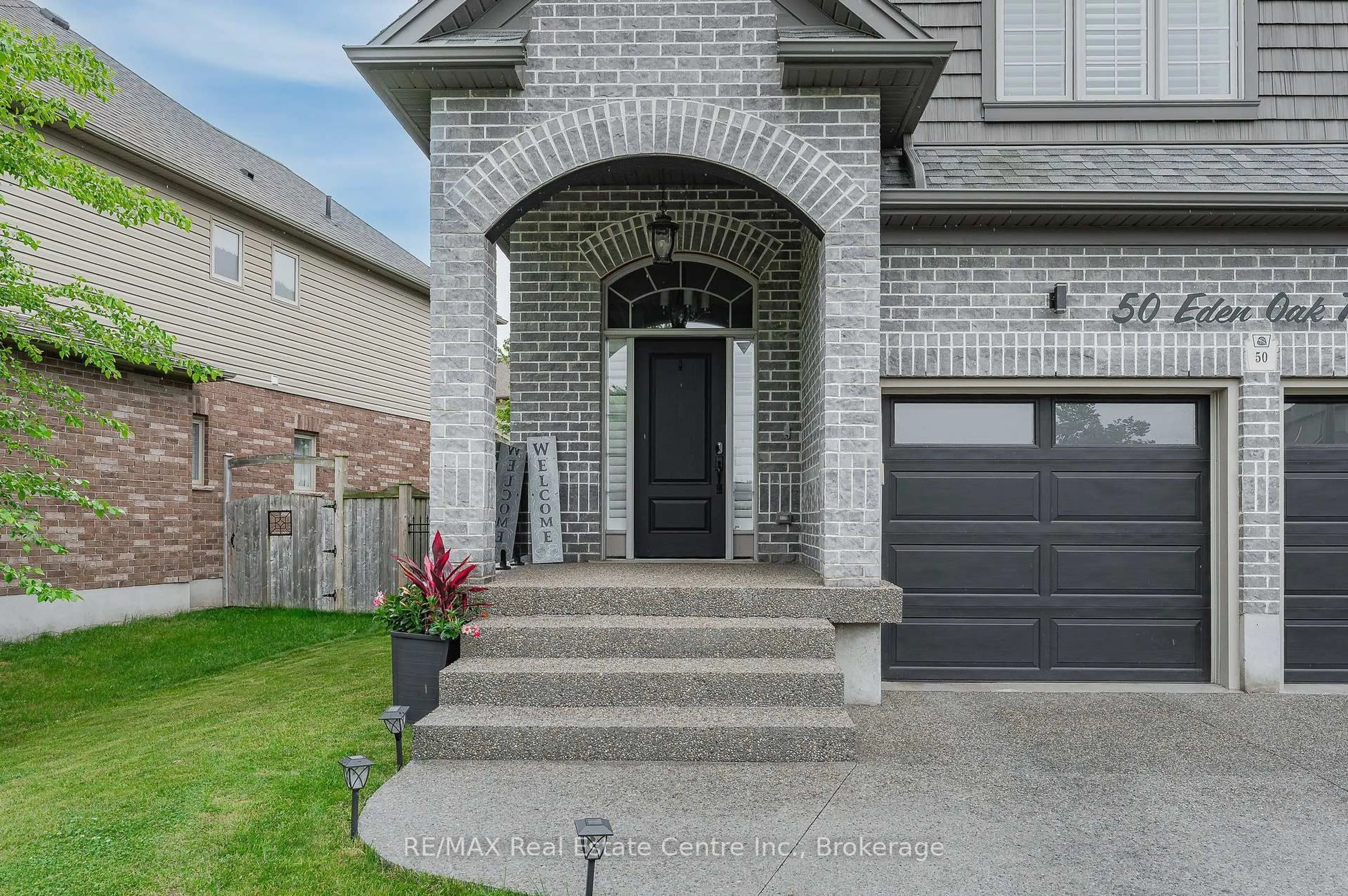 Home with brick exterior material, street for 50 Eden Oak Tr, Kitchener Ontario N2A 0G3