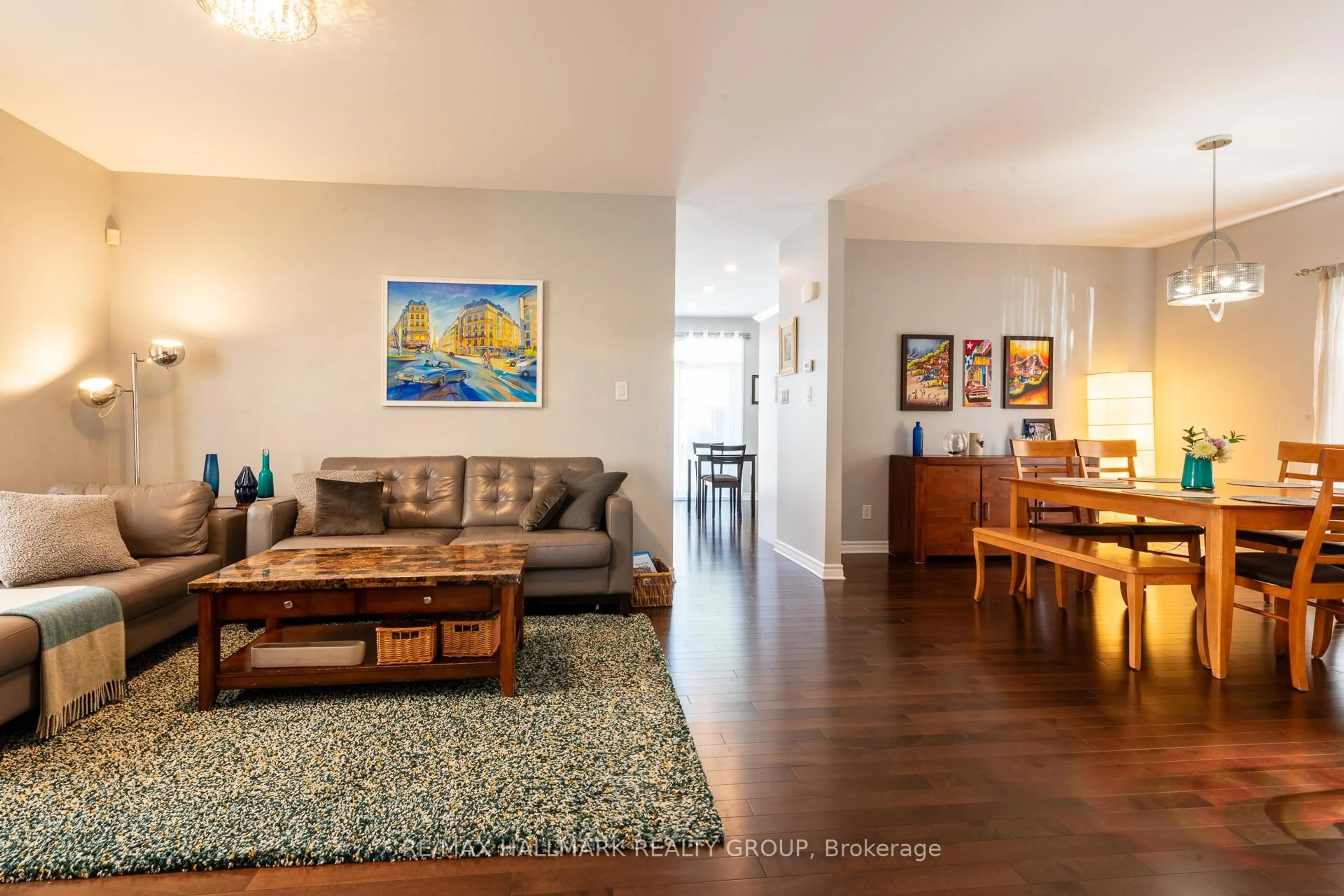 Living room with furniture, wood/laminate floor for 217 Fountainhead Dr, Ottawa Ontario K1W 0C2