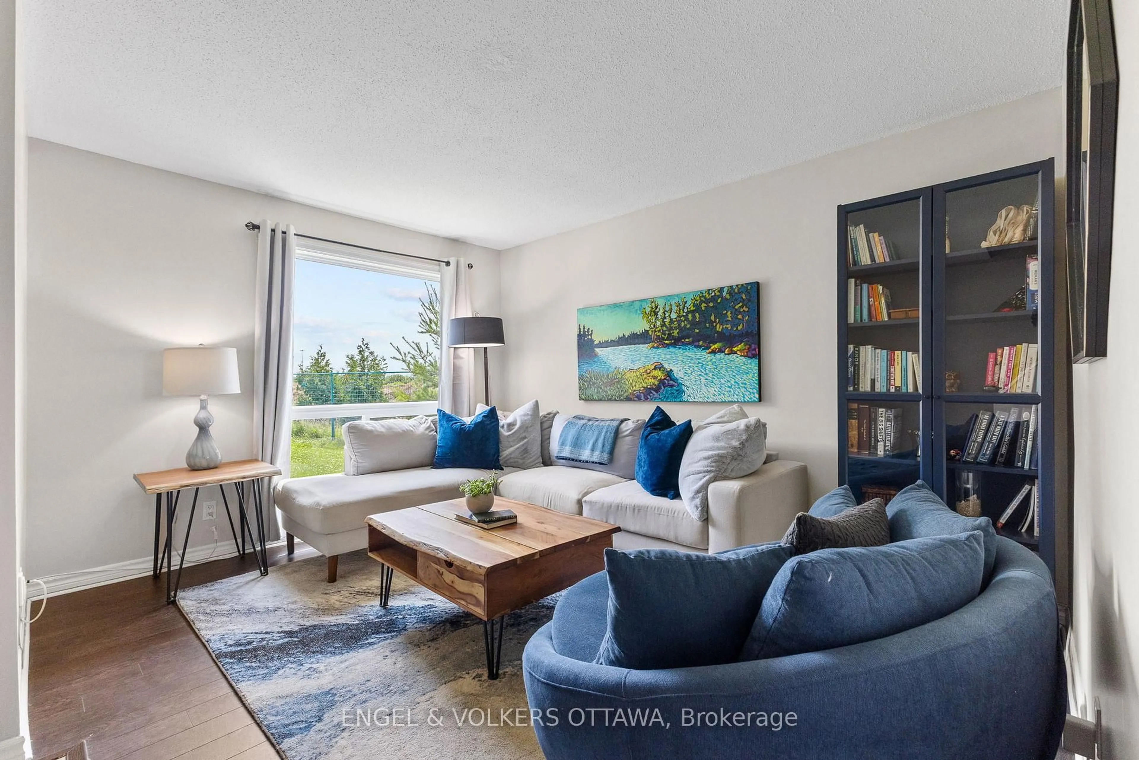 Living room with furniture, wood/laminate floor for 1387 Perez Cres, Ottawa Ontario K1J 8V3